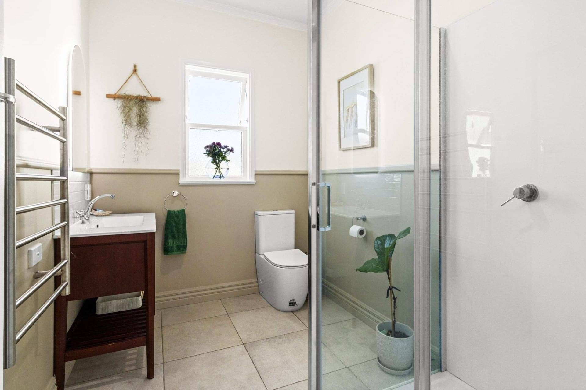 Renovated bathroom with a new shower, heated towel rail, vanity and toilet