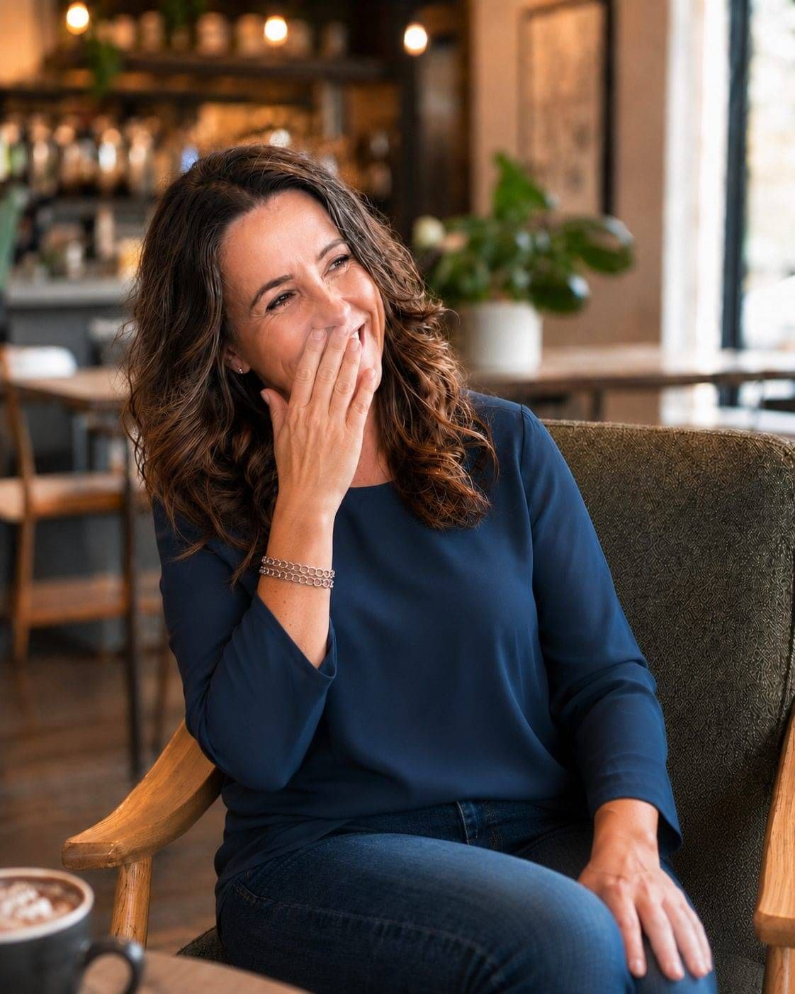 Natasya Jones laughing in a café