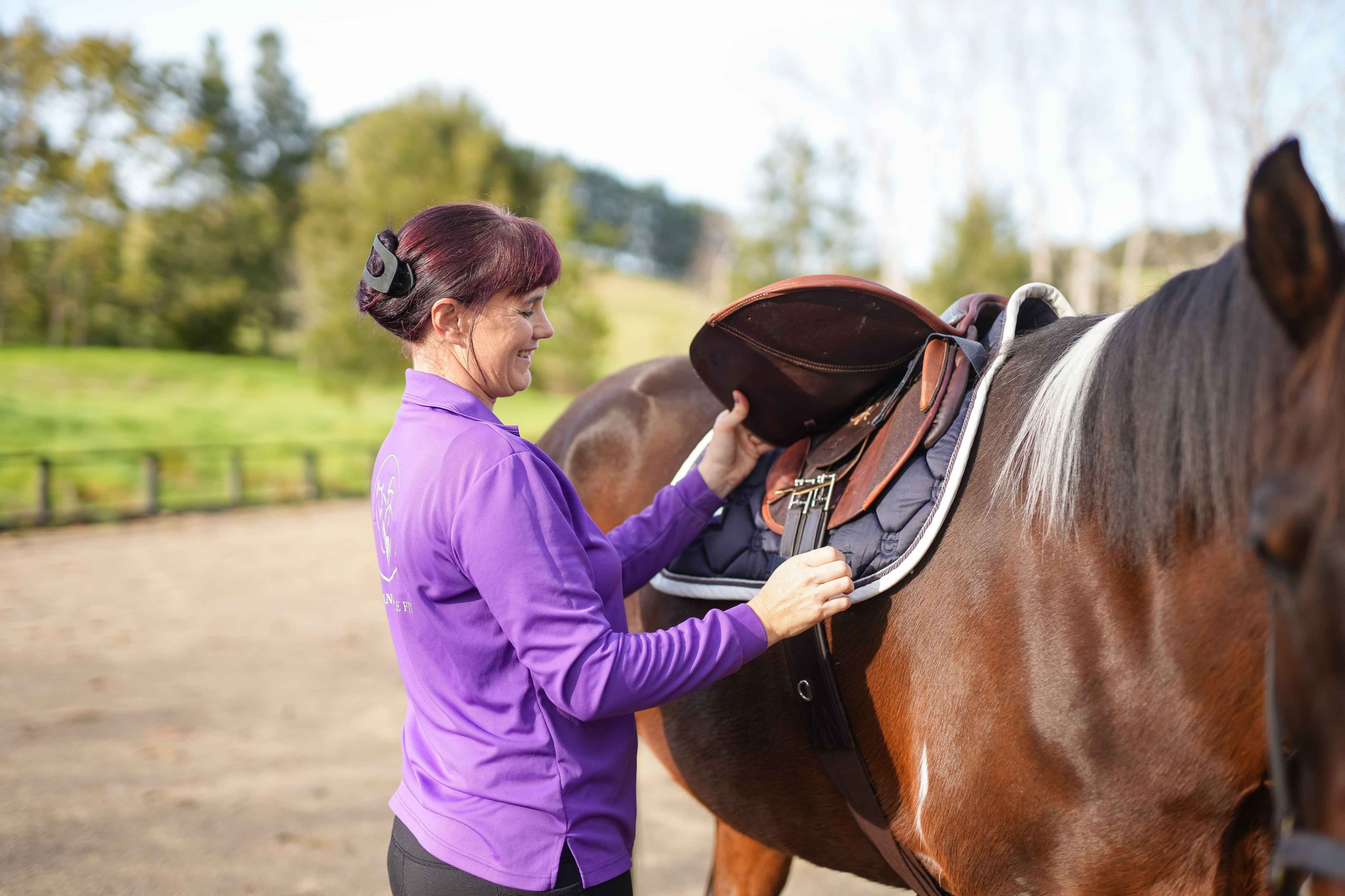 Christine, holistic saddle fitter, measuring horse girth