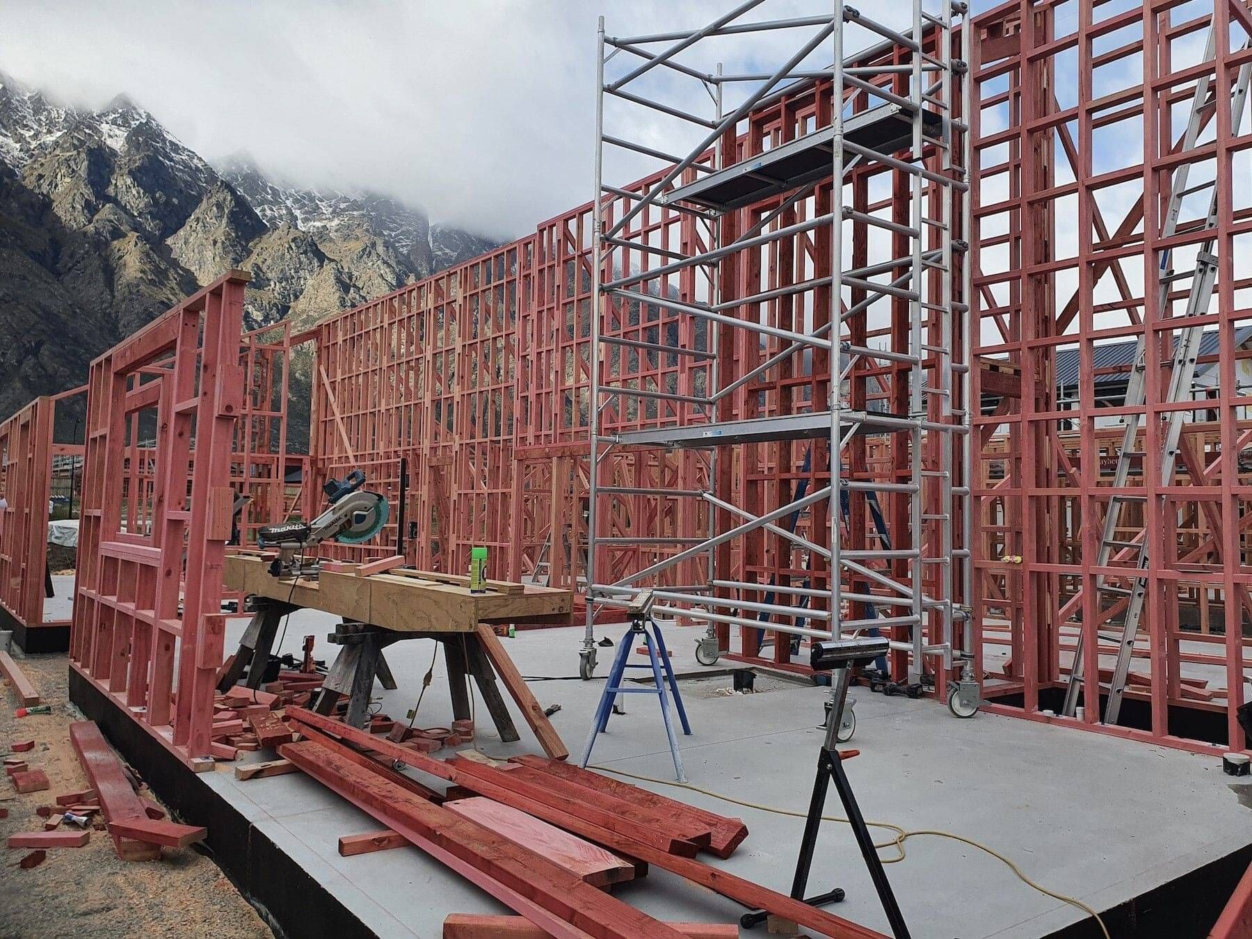 House frames being stood at a project by Camako Builders Queenstown.