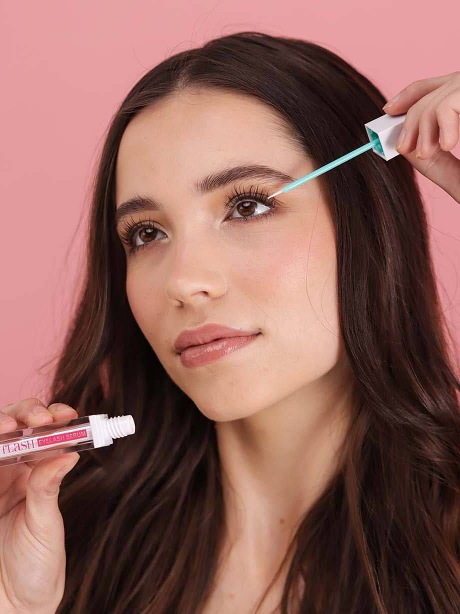 Beauty photoshoot of woman using mascara