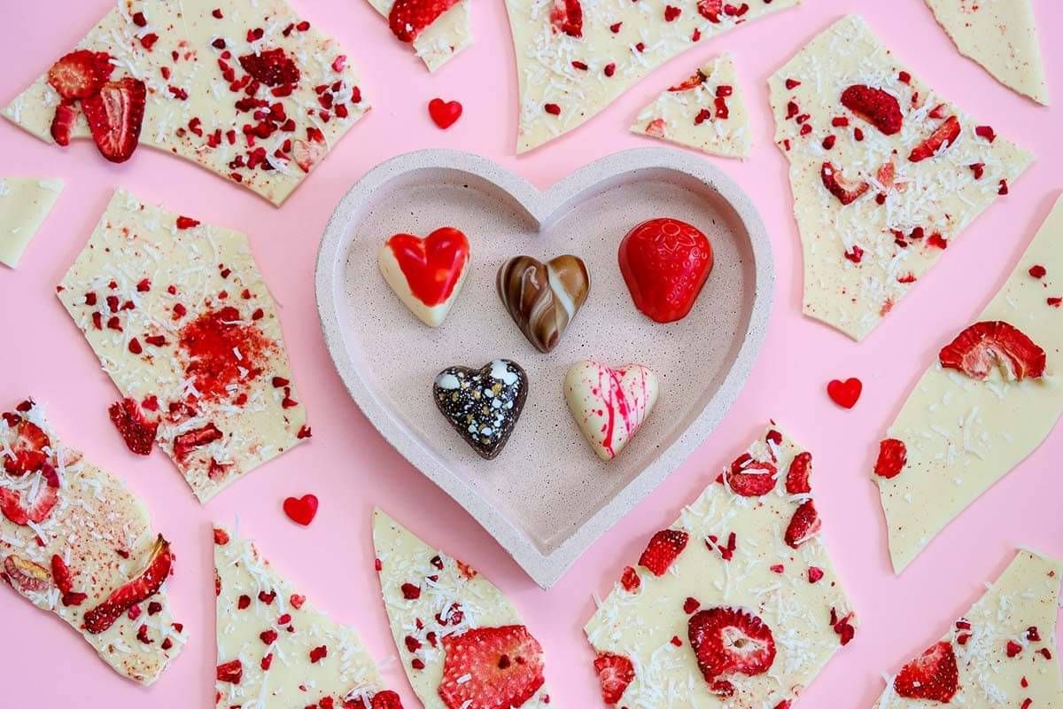 Product photo of chocolates on pink background