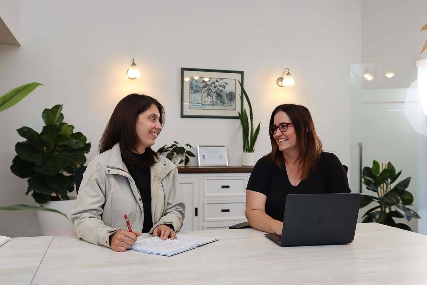 Corporate photo of two female accountants