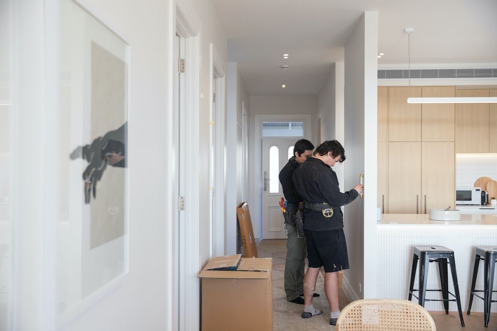 Residential electricians completing the electrical fit-off in an Auckland home