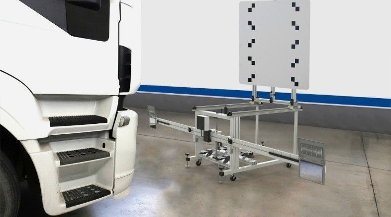Vehicle undergoing ADAS calibration with AECS equipment