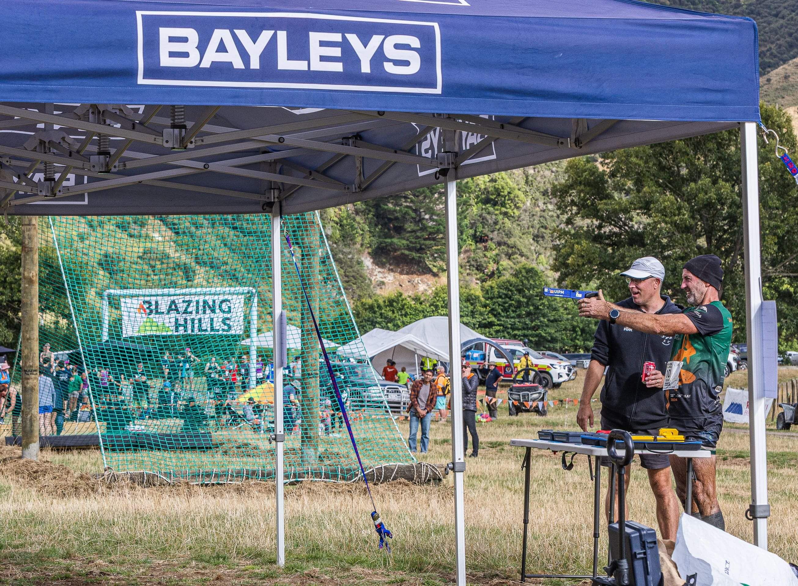 The event hub with people relaxing, enjoying home cooked food, a refreshing drink, and enjoying the entertainment 