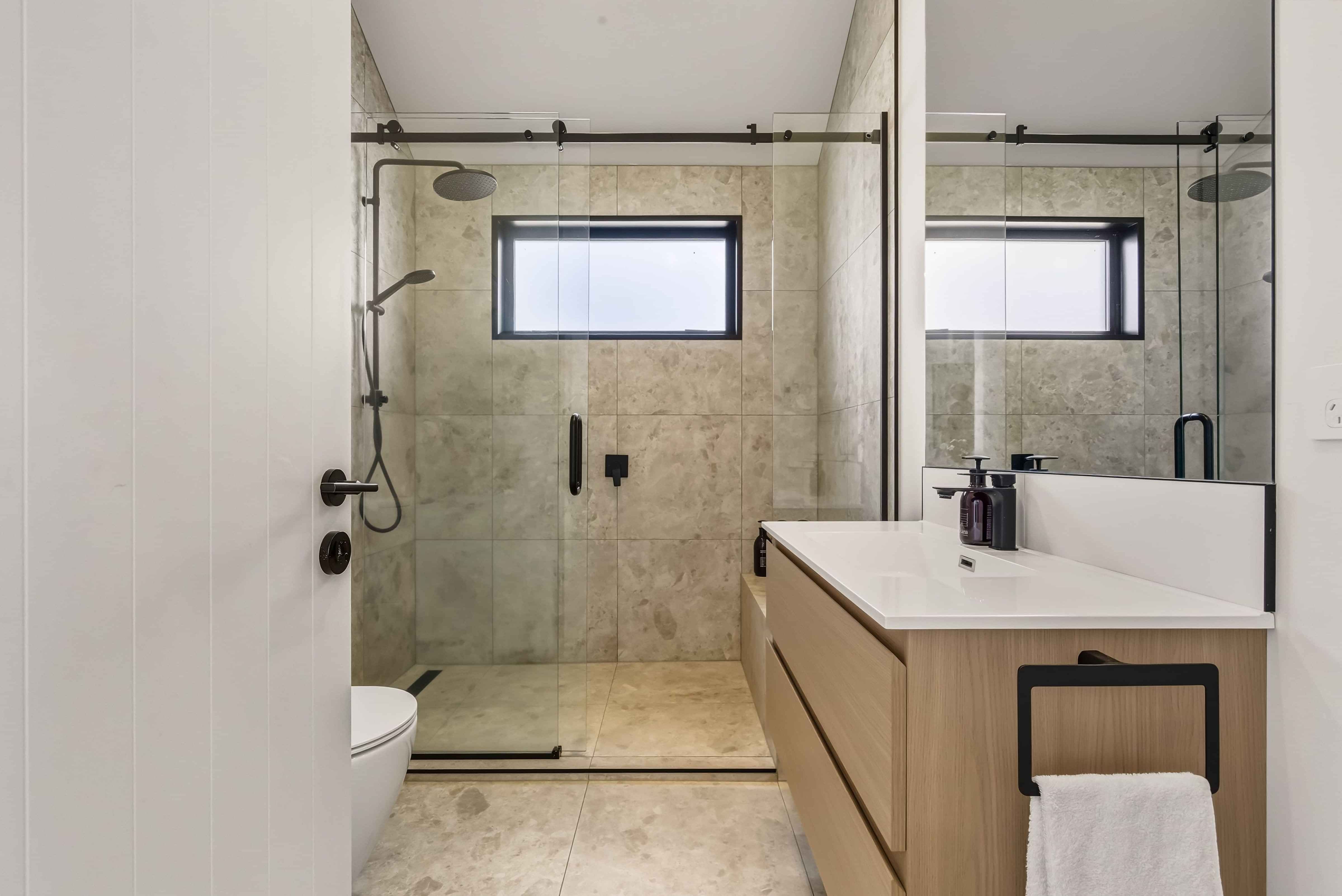 athroom with double head shower and vanity in a Roam Taupo upper terrace unit