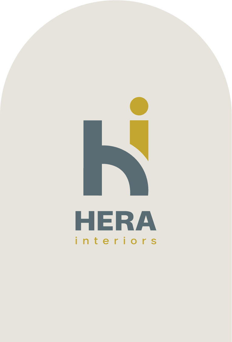 Hera Interiors logo on a light beige arch background, featuring a bold "hi" in gray and mustard, with "HERA interiors" below
