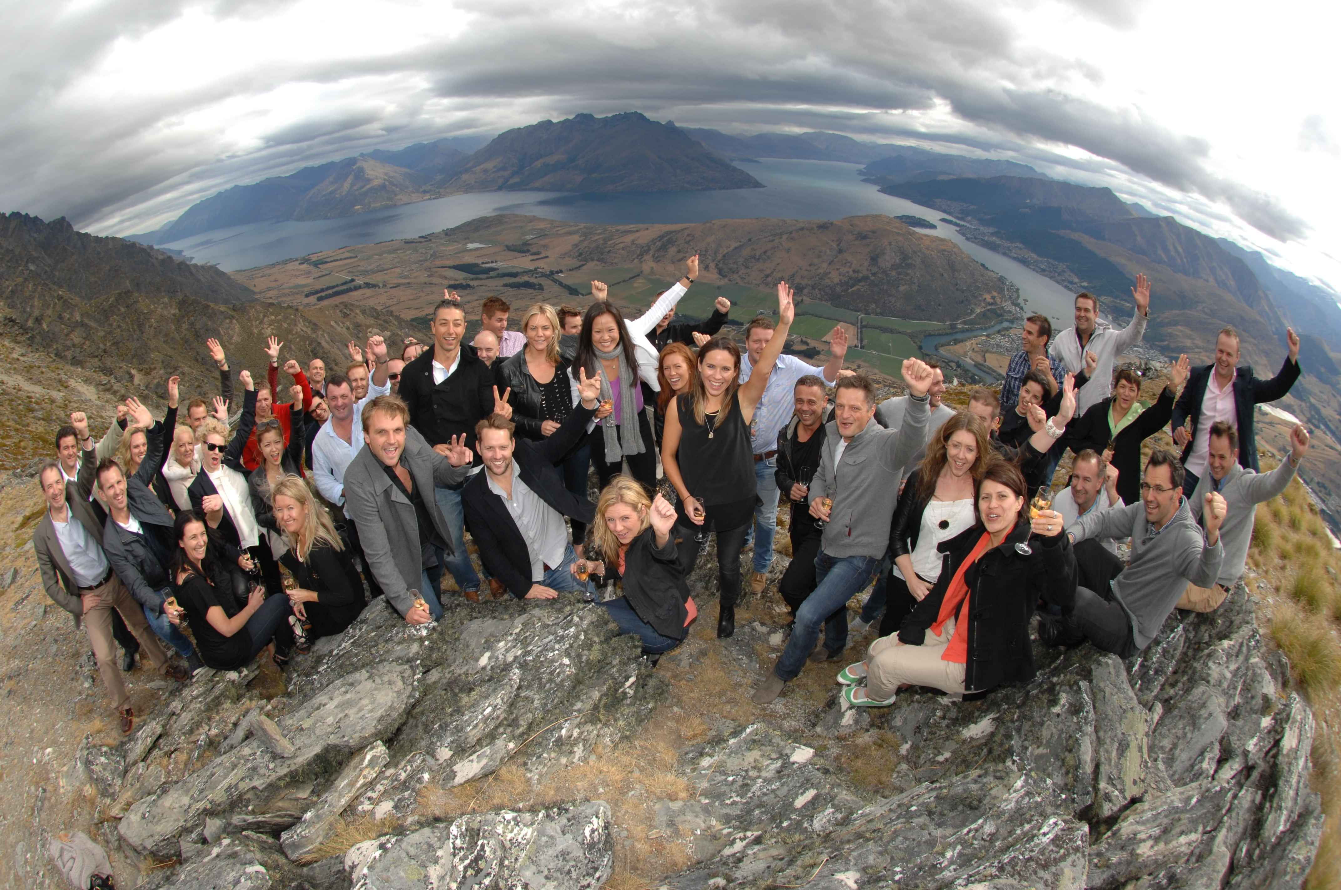 A conference group celebrating up on a Queenstown mountain overlooking the incredible Lake Wakatipu. Part of Little Big Events Destination Management.