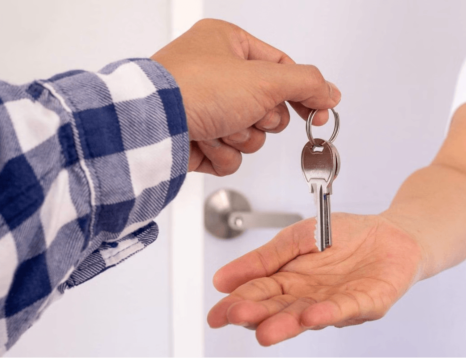 Image of person handing keys over. Hutt Valley Community Housing. 4 A Better City Charitable Trust. Hutt Valley. New Zealand.