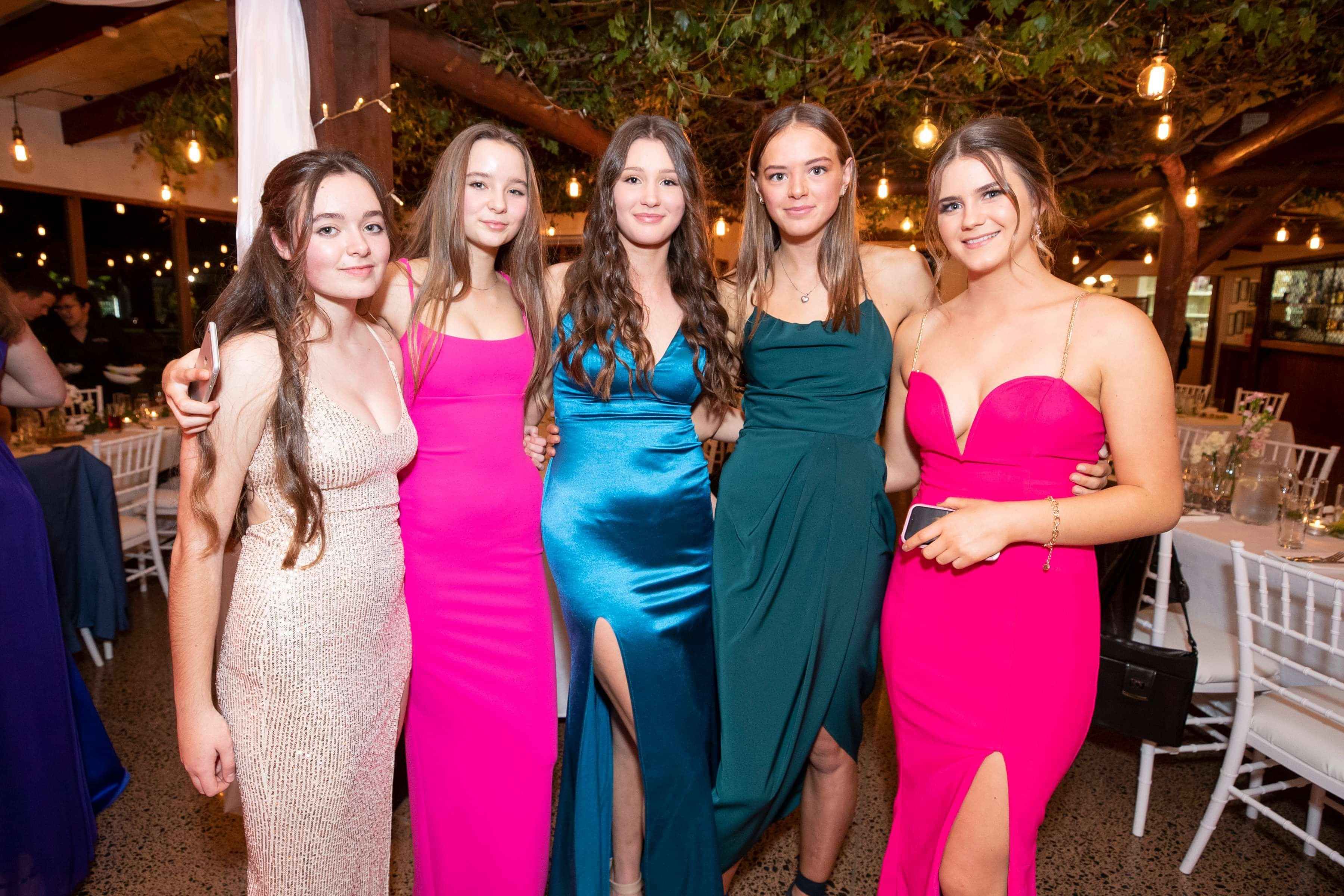 guests posing for a photo at school ball