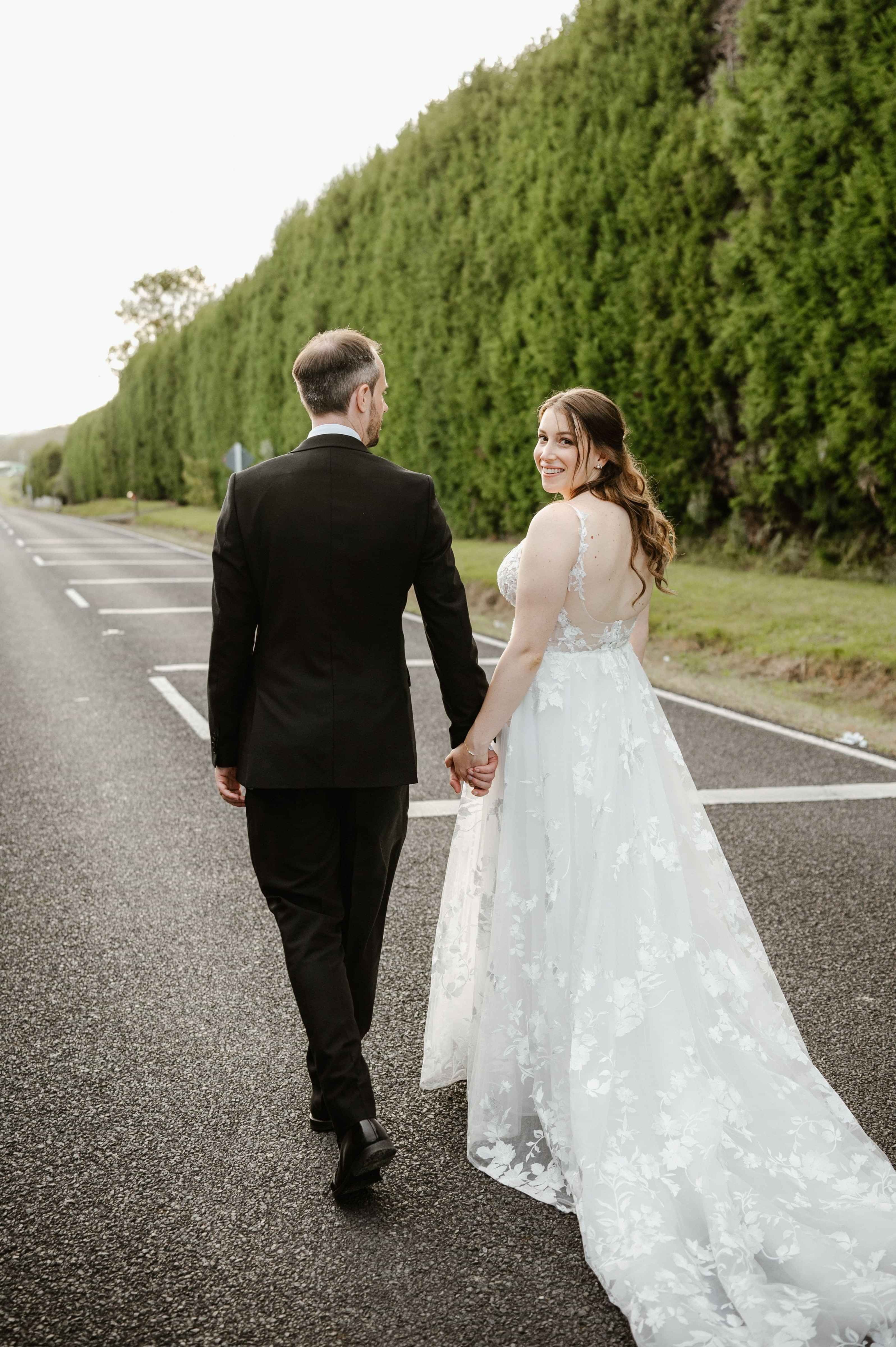 shot of bride and groom from the back