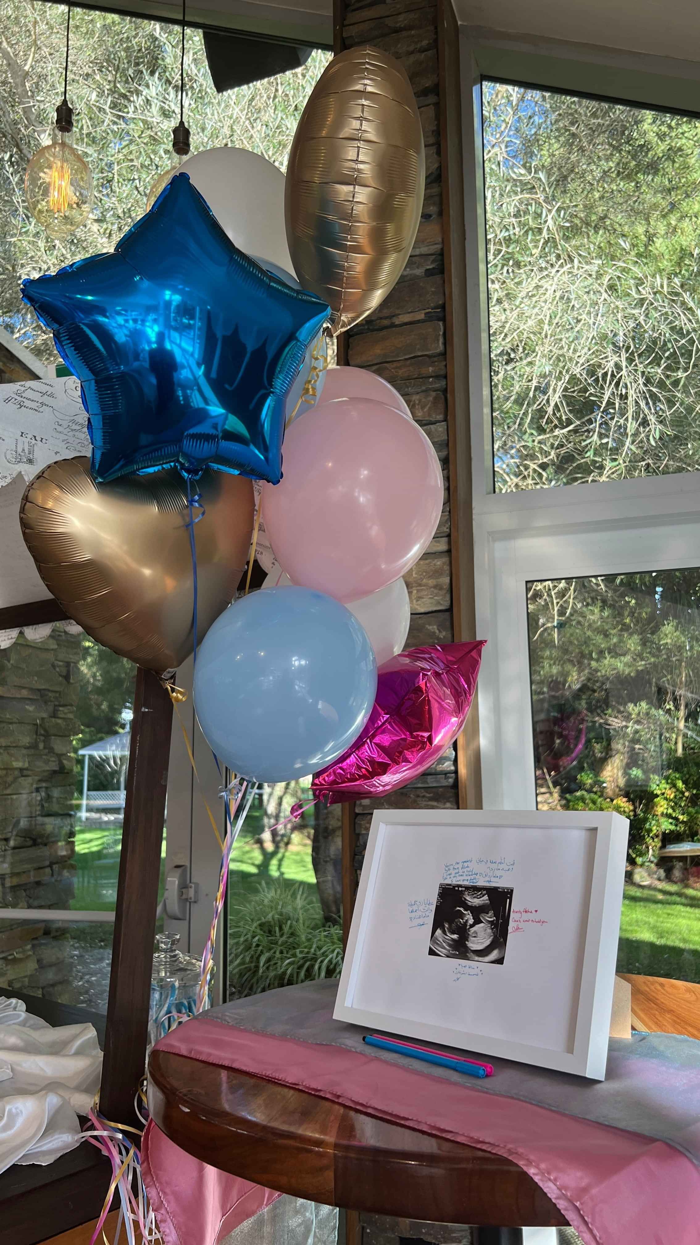 blue, pink, and gold balloons