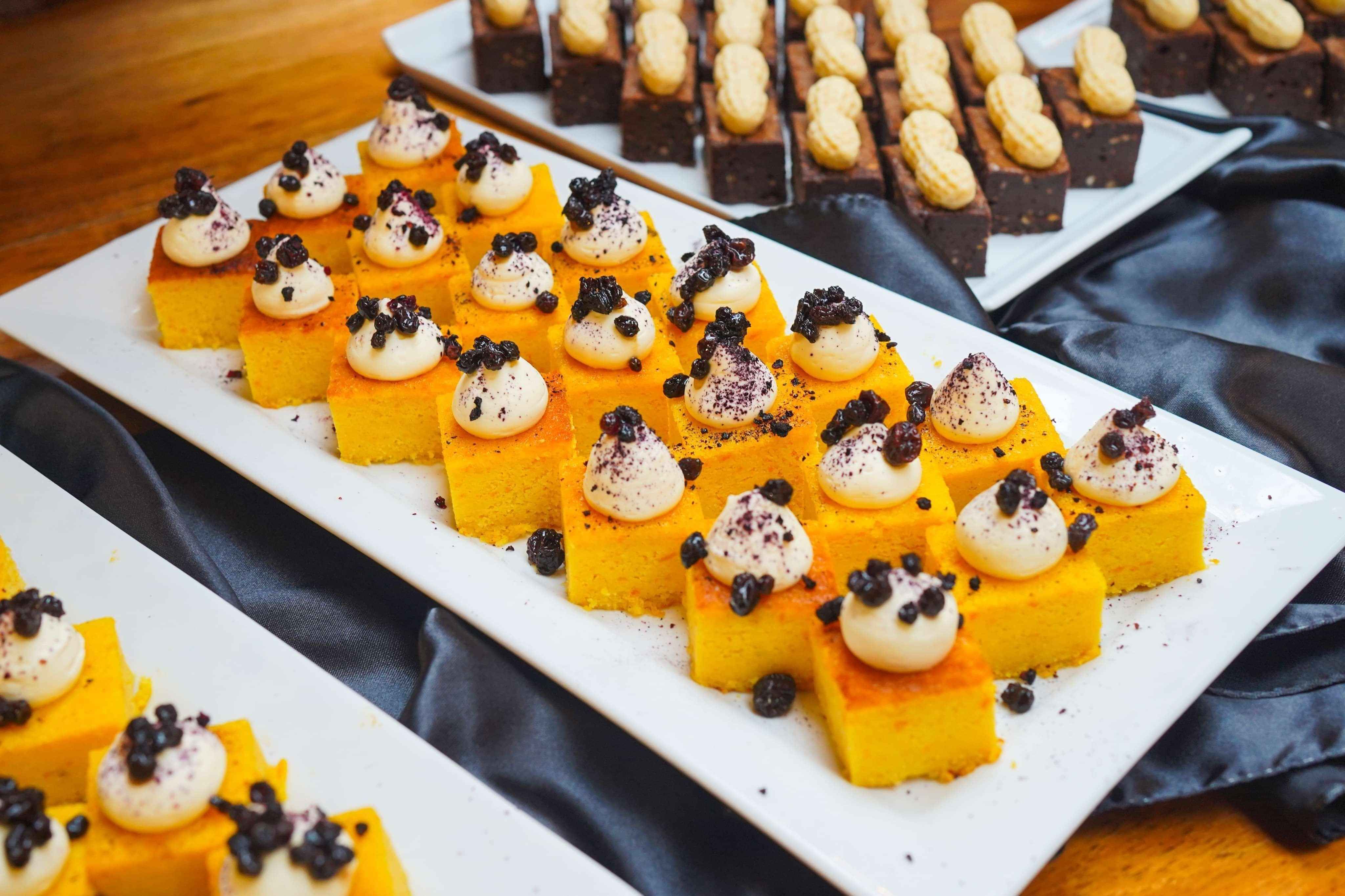 square mini cakes on a platter