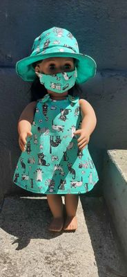 Pinafore style dress, hat and mask, green cat print.  Fits 46cm doll