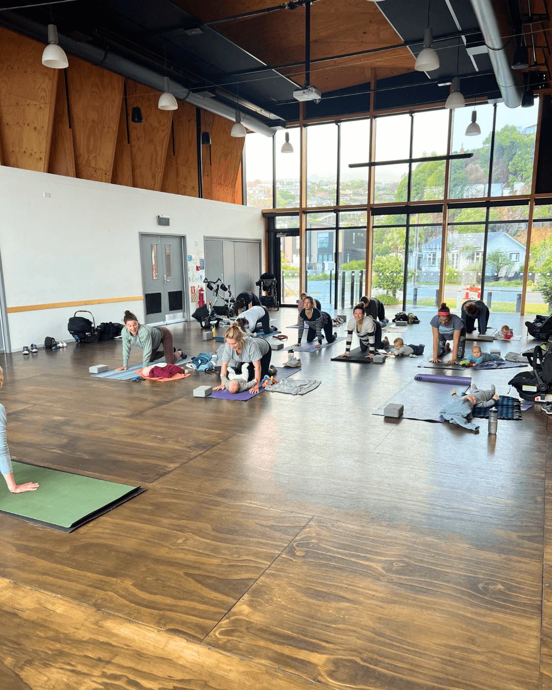Photo showing yoga session for māmās and babies at a Beautiful Beginnings Community event