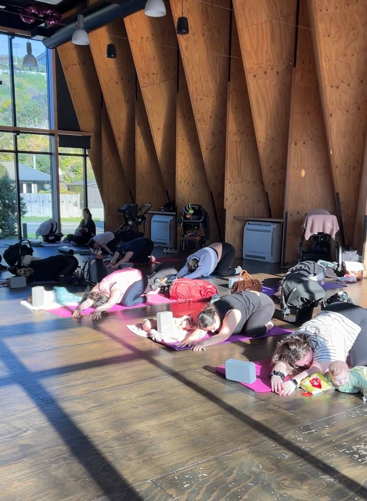 Photo showing yoga session for māmās and babies at a Beautiful Beginnings Community event