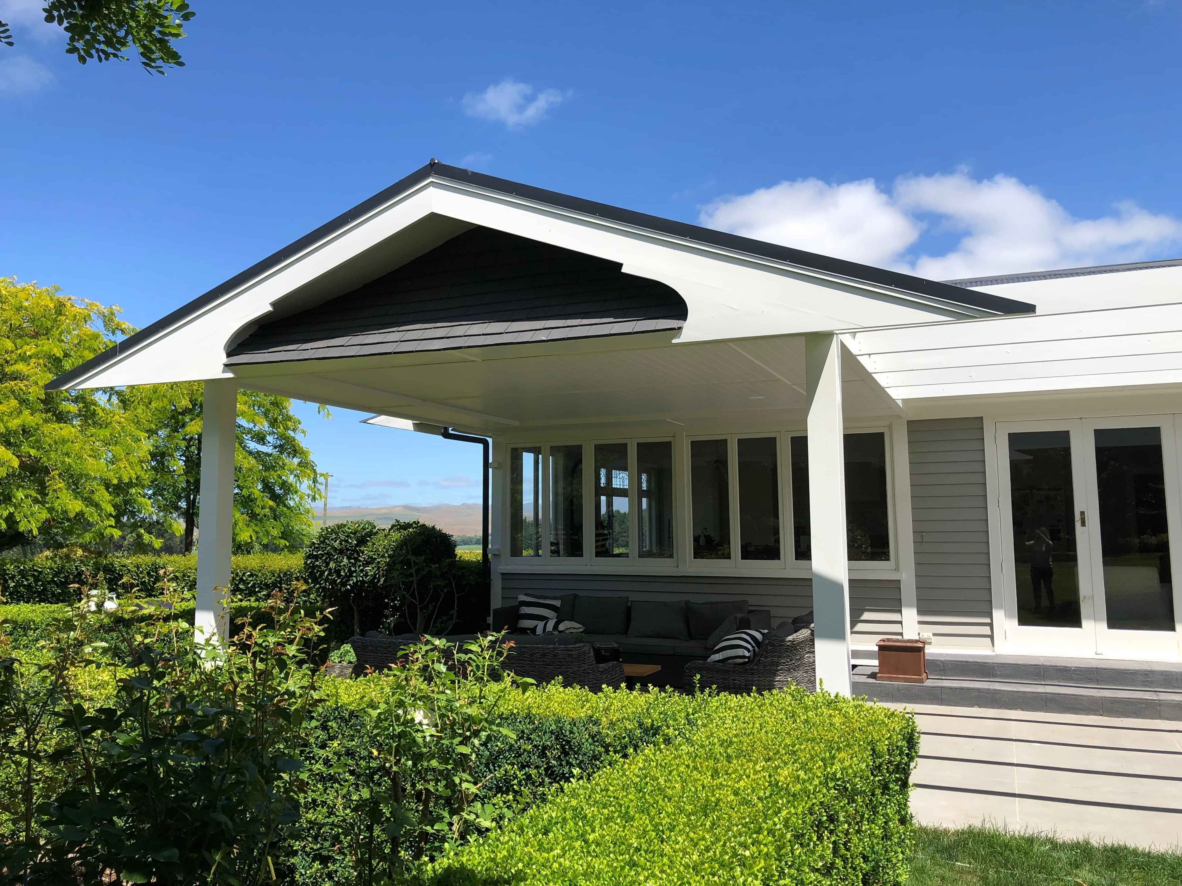 The front view of a veranda renovation project with an attached pergola, built by Scarlet Construction.