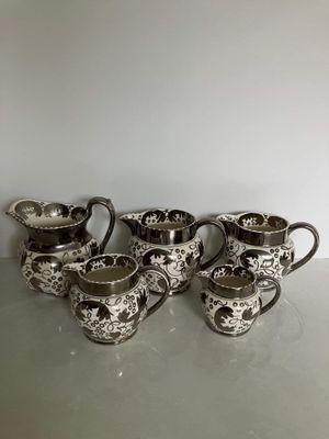 Set of Five Wedgwood Lustreware Graduating Jugs