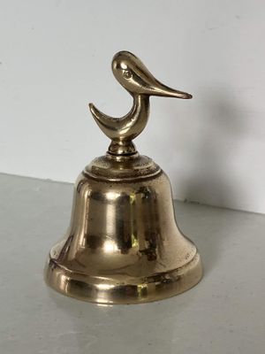 Small mid-century brass bell with bird handle