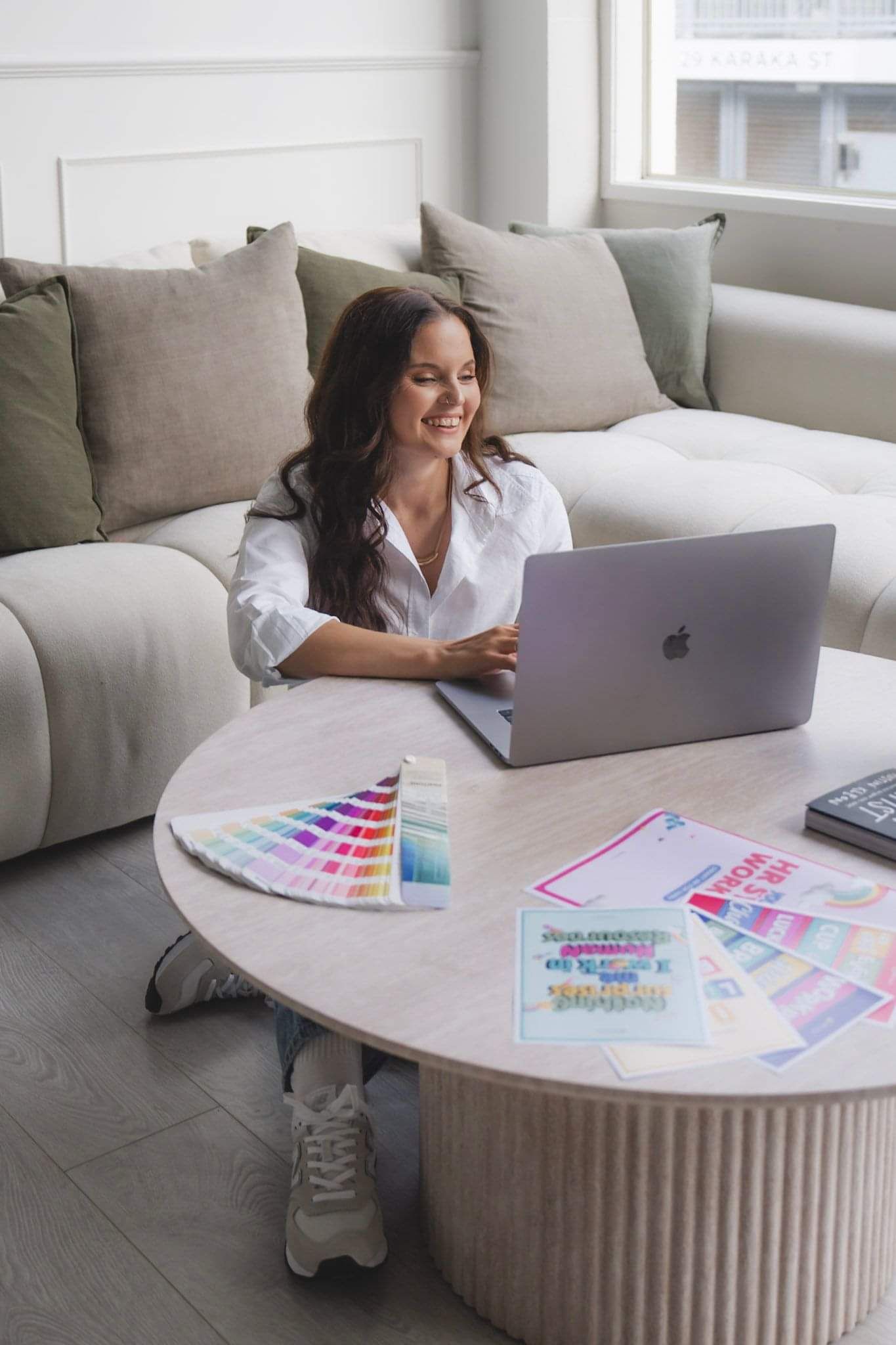 Laykanne on laptop with graphic design work displayed