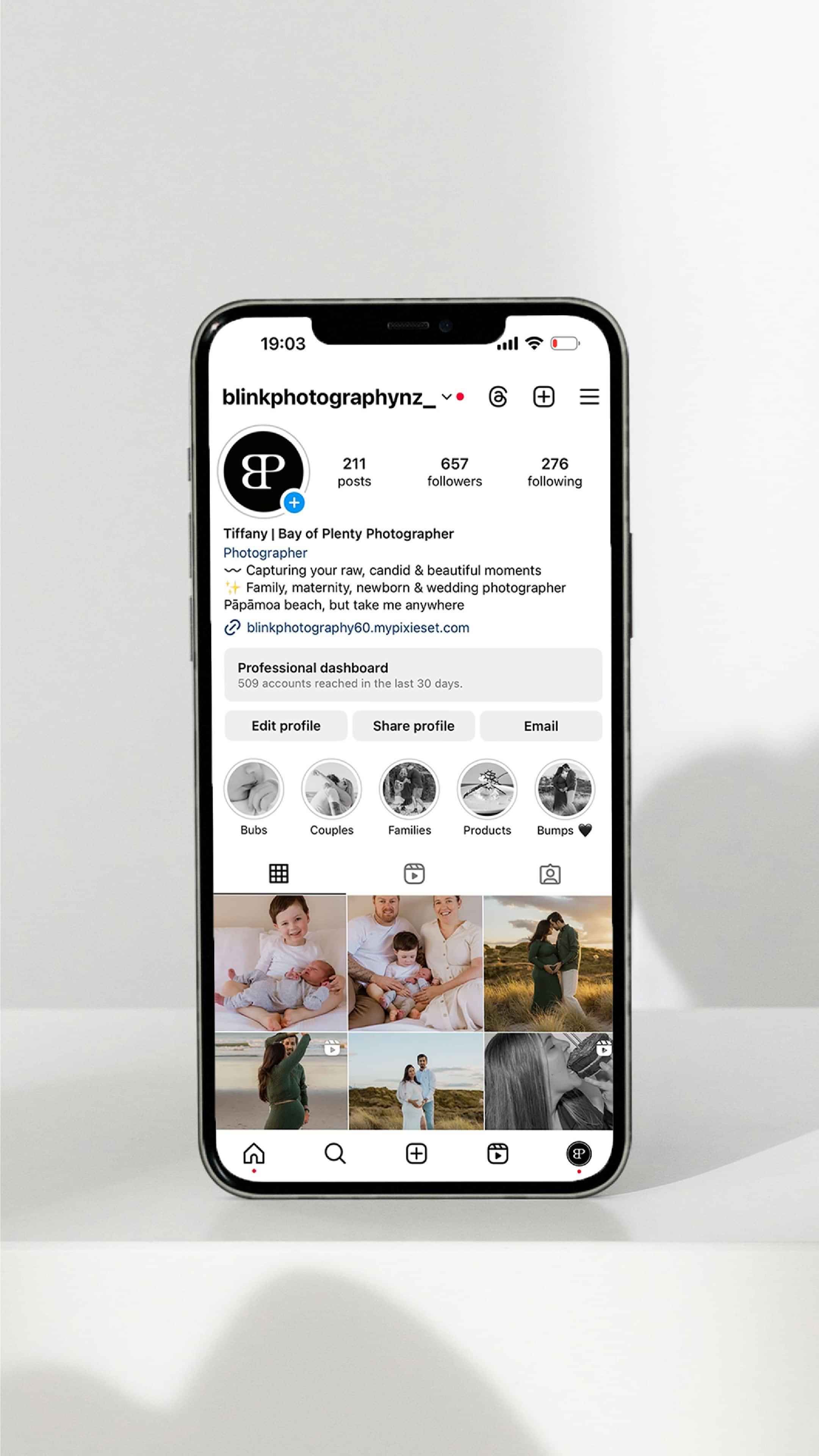 Smartphone displaying an Instagram profile for 'Blink Photography.'