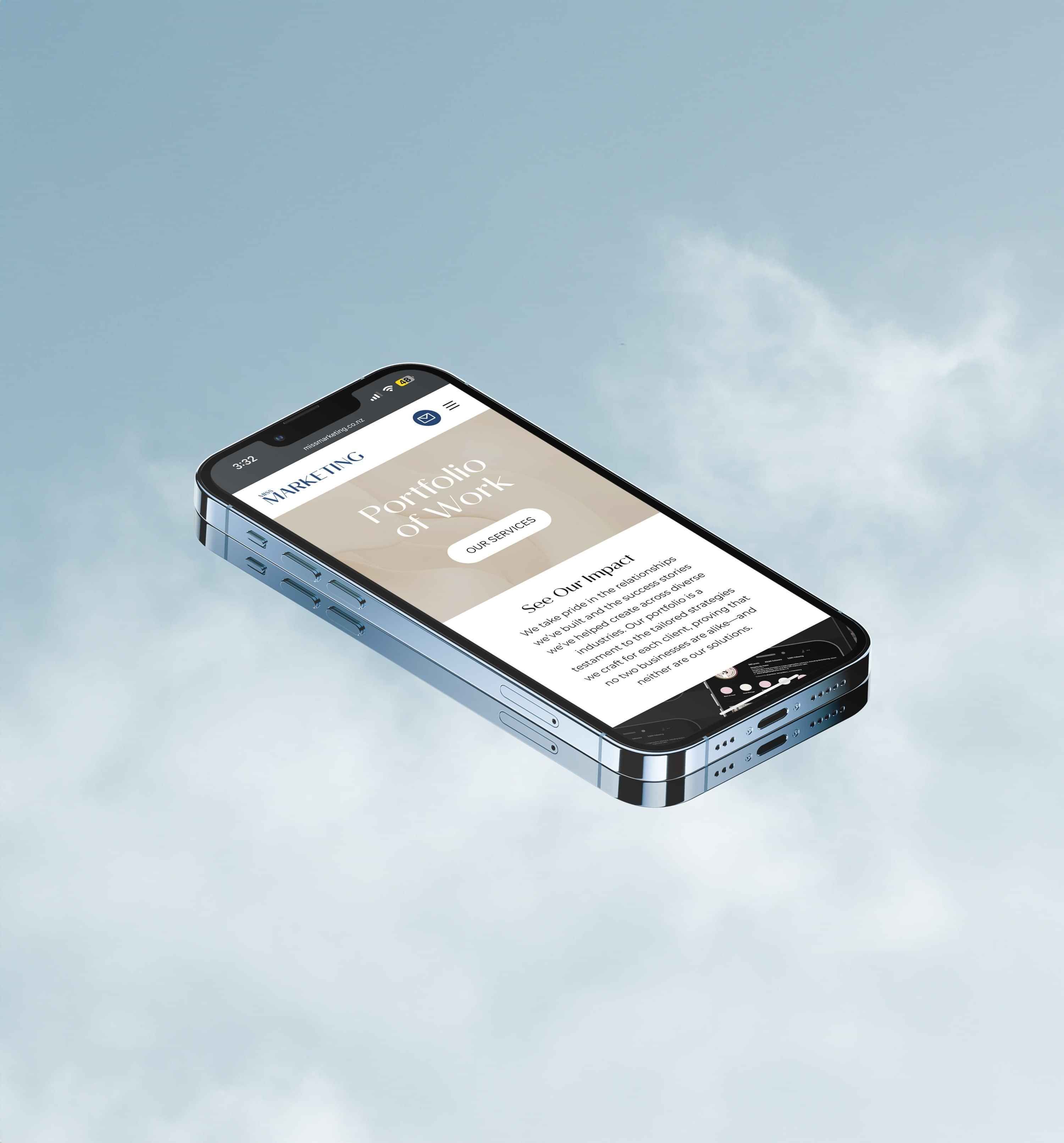 A silver smartphone displaying a mobile-friendly 'Portfolio of Work' page with a light brown colour palette, against a soft blue background.