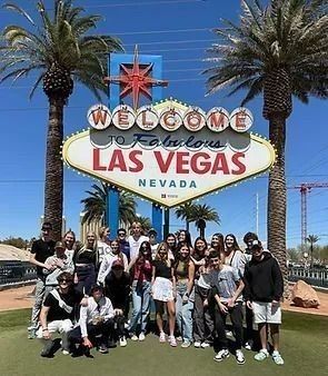 A group of RYE students standing in front of the Welcome to Fabulous Las Vegas sign