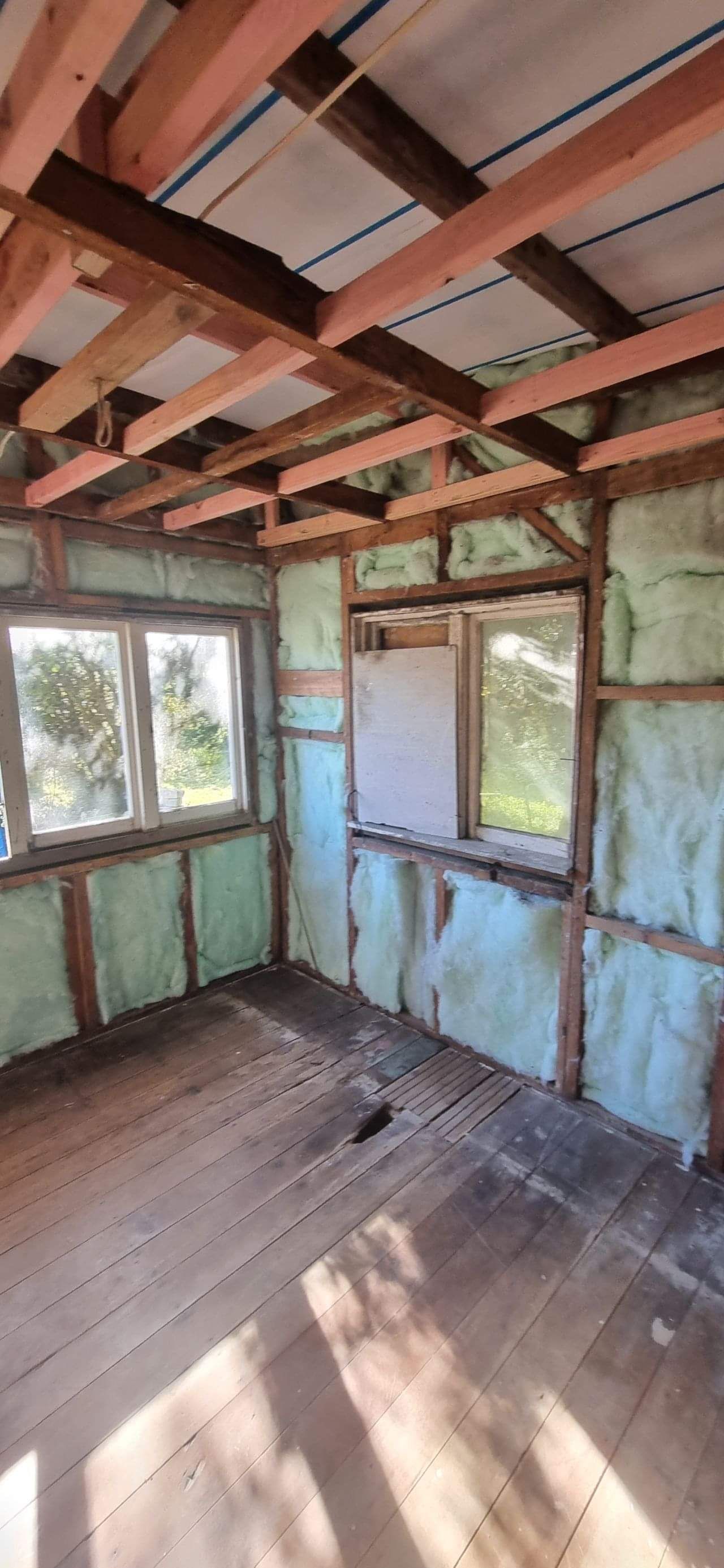 Interior wall framing demonstrating sustainable building improvements and retrofit work