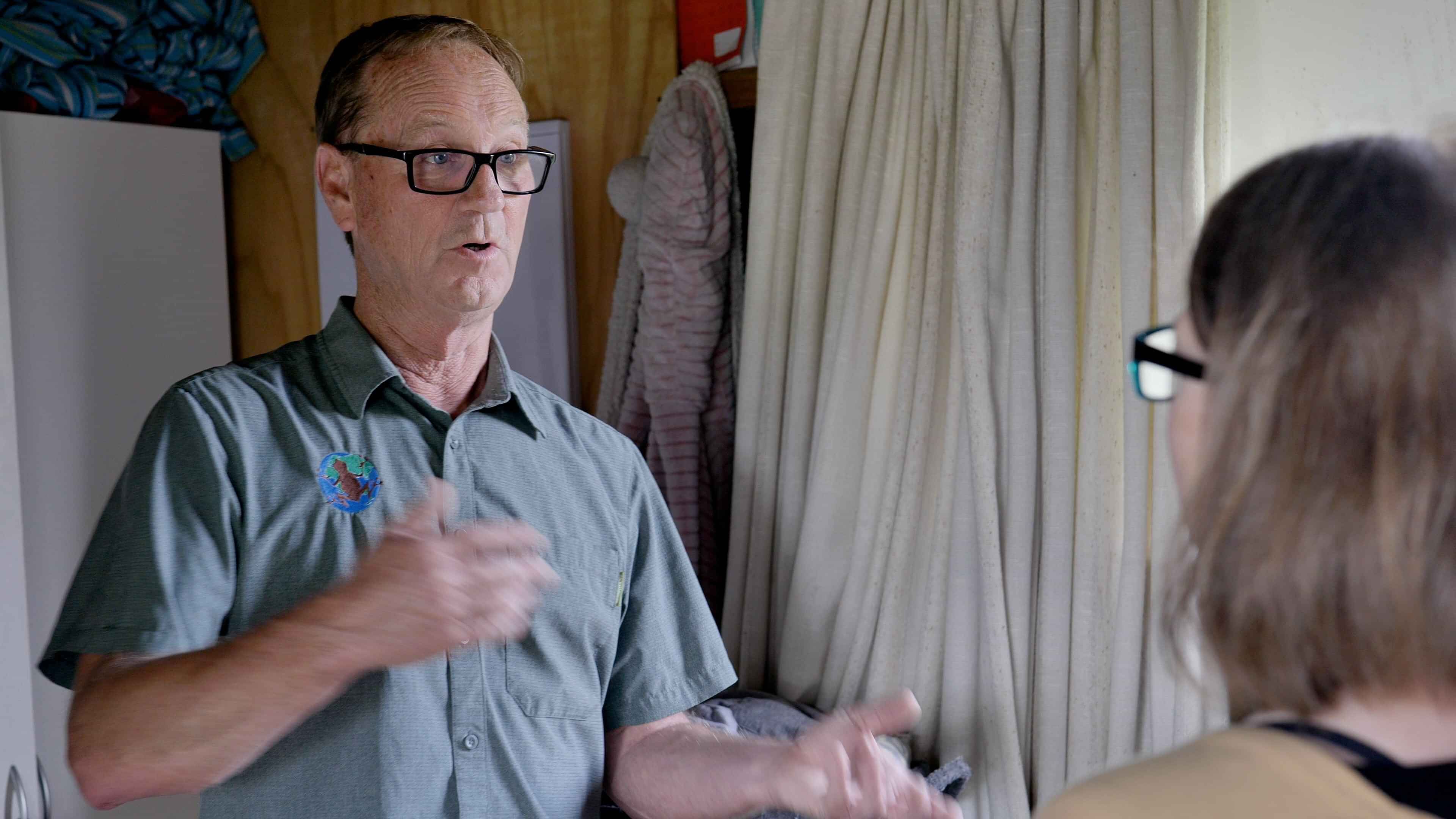 two people in conversation in a house
