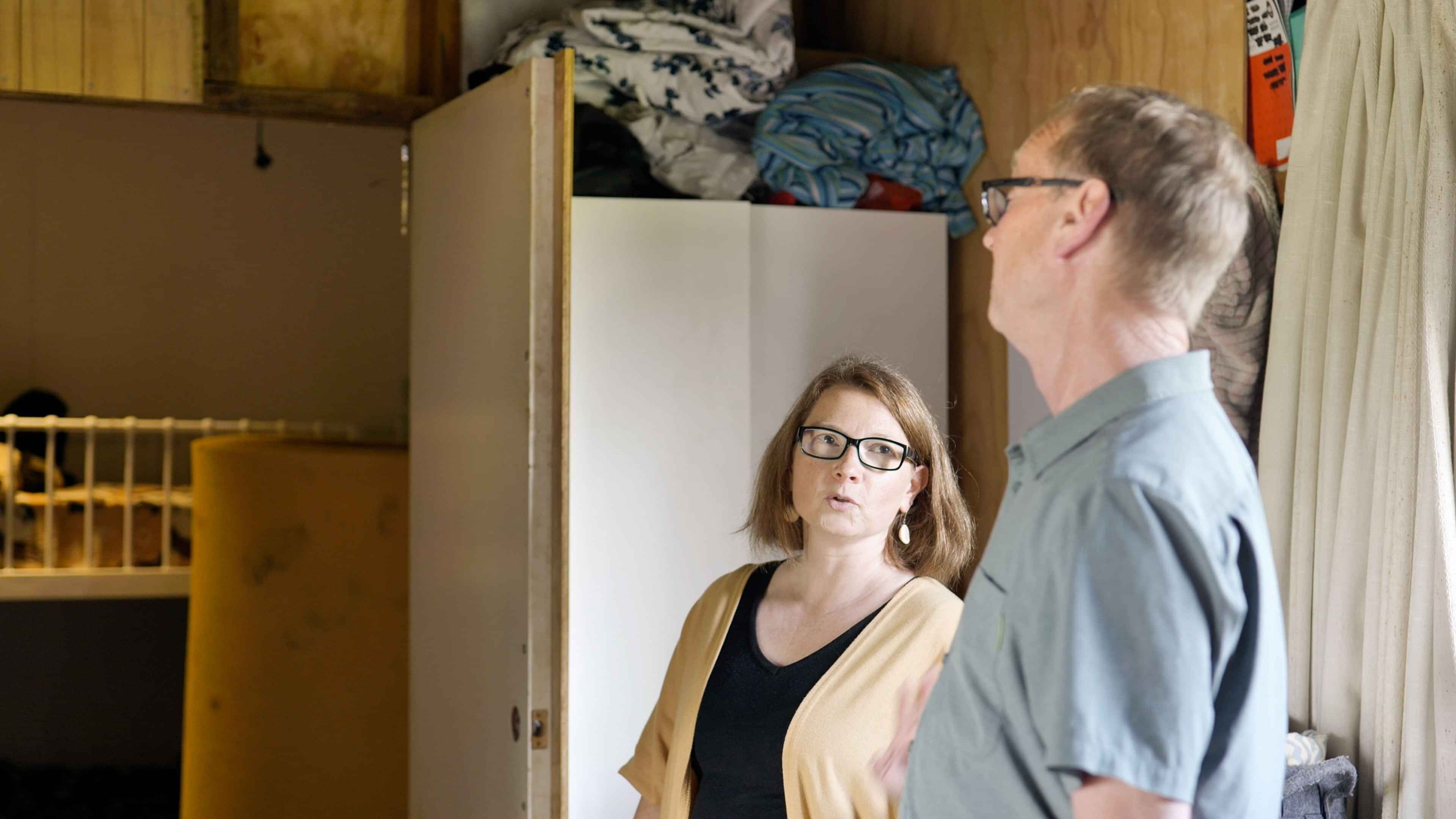 two people in discussion in house