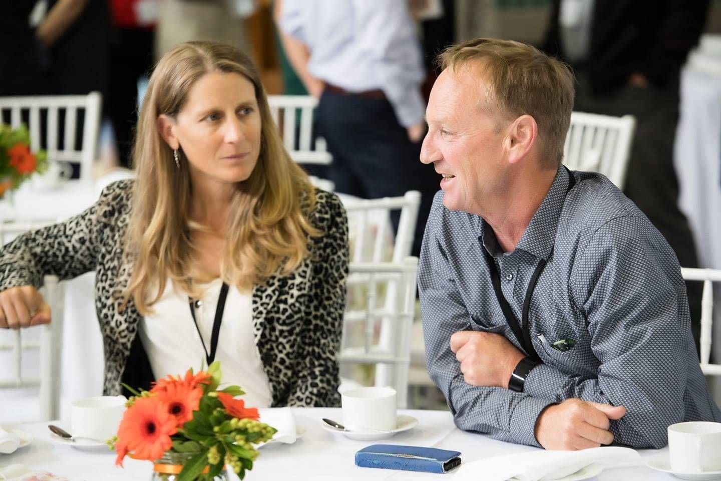 two people having conversation at event