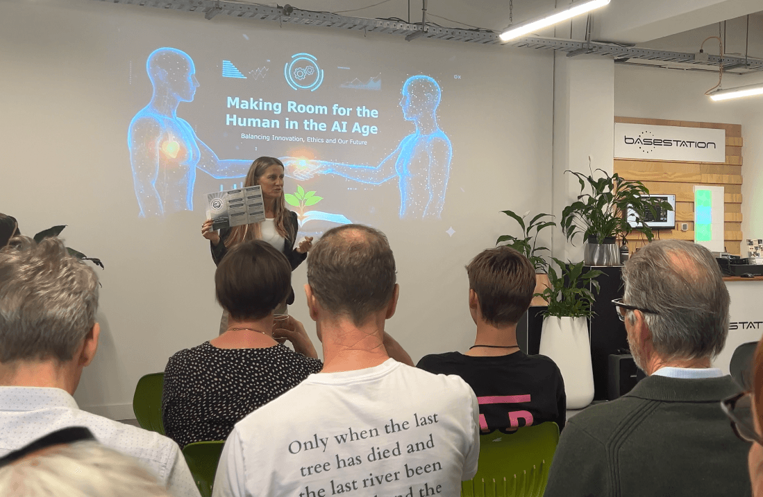 Presenter speaking to an audience during a community sustainability event