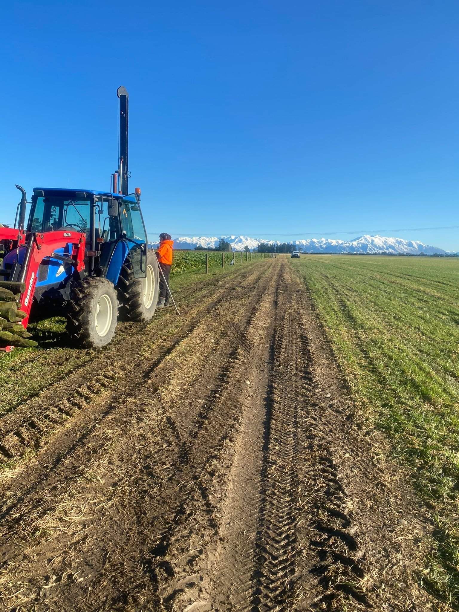 Post and rail fence around a centre pivot