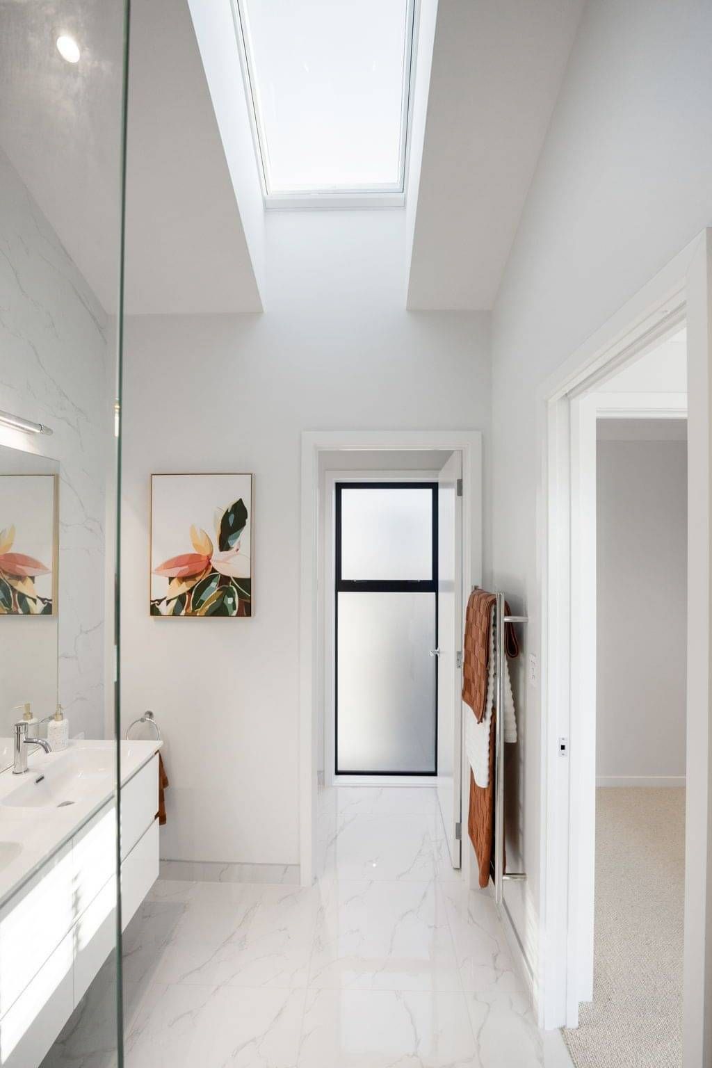 Image of marble tiled bathroom in new build by Whitechurch Construction, Waikato residential builders.