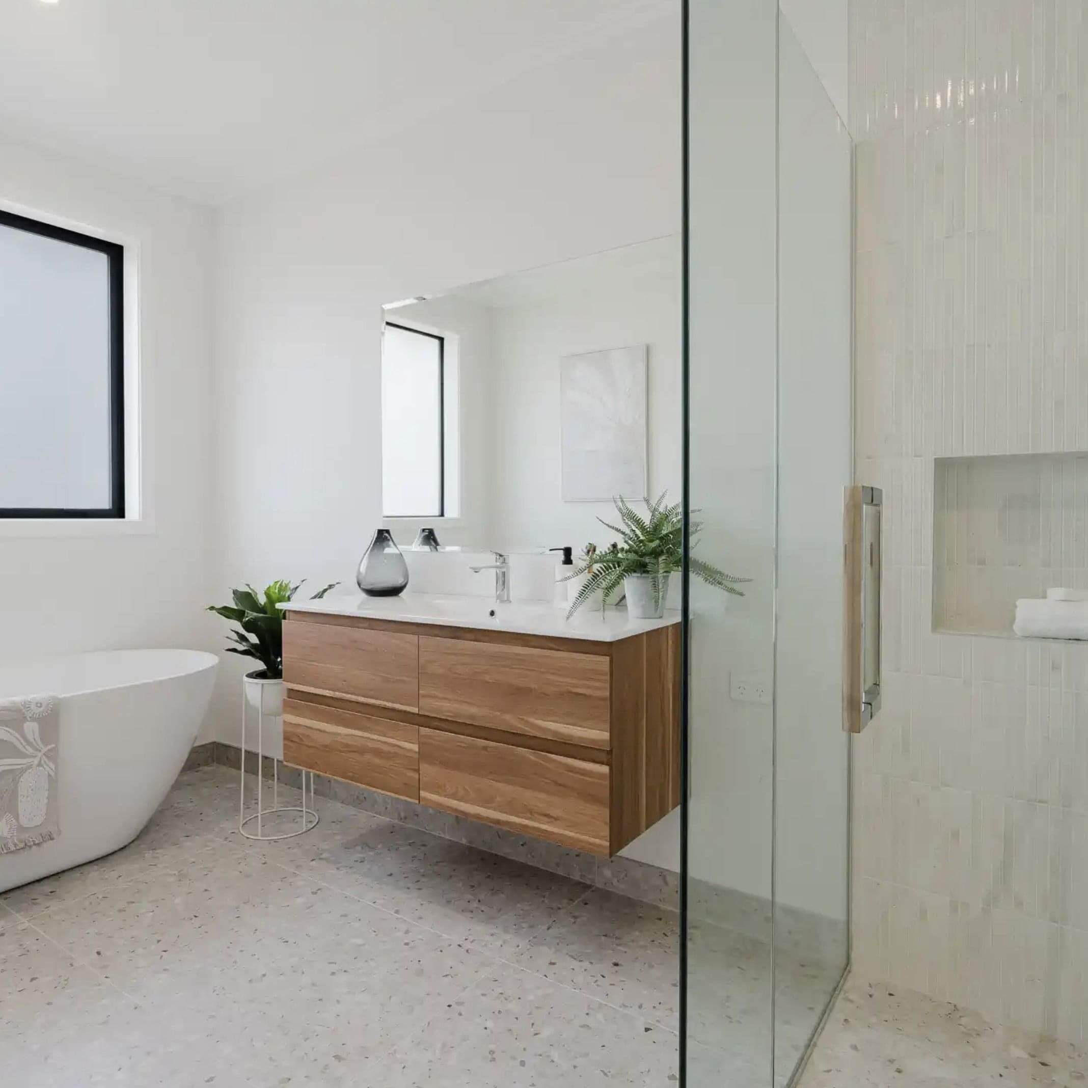 Image of marble tiled bathroom in new build by Whitechurch Construction, Waikato residential builders.