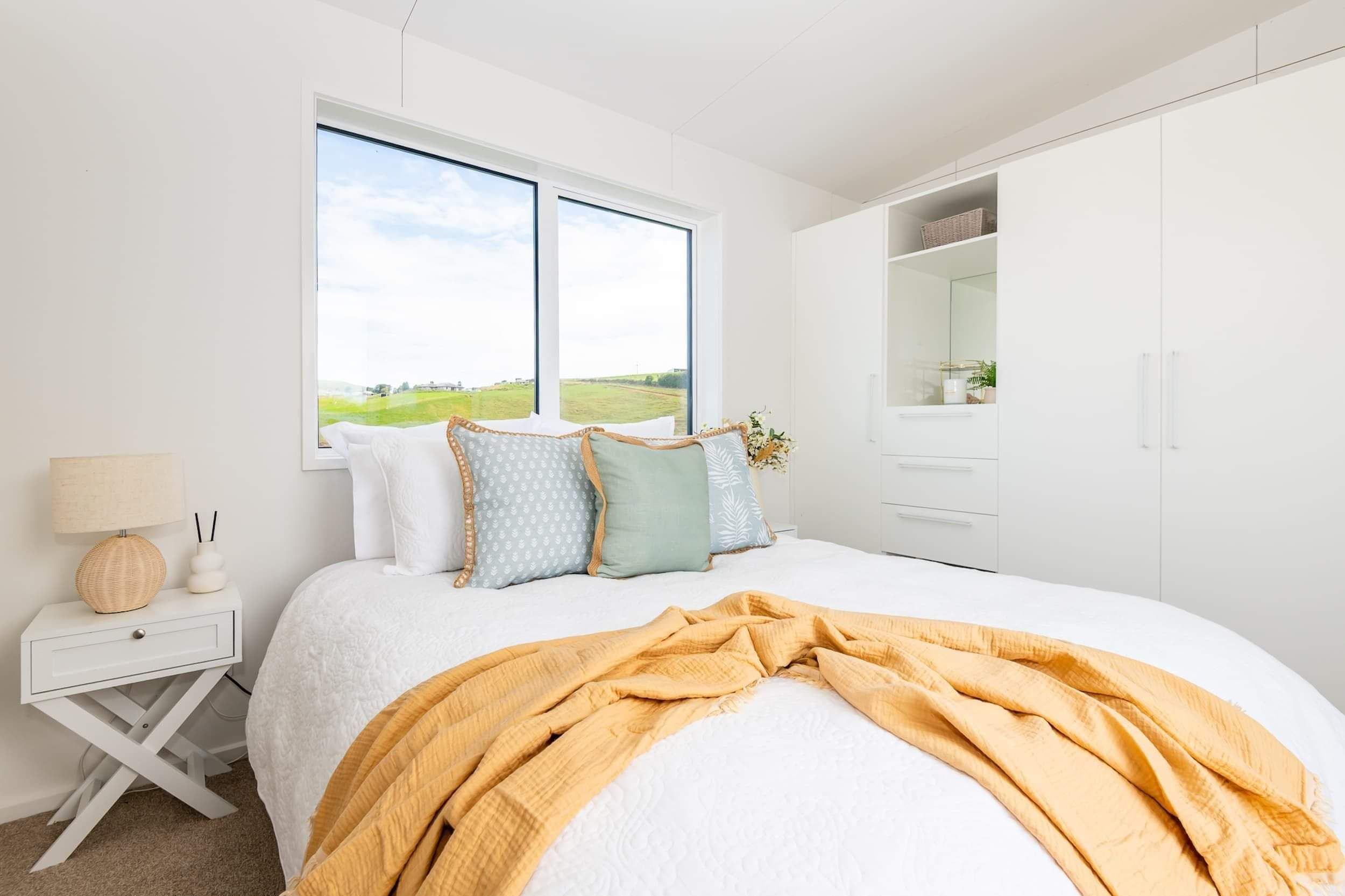 tiny home cabin master bedroom showing tidy bed