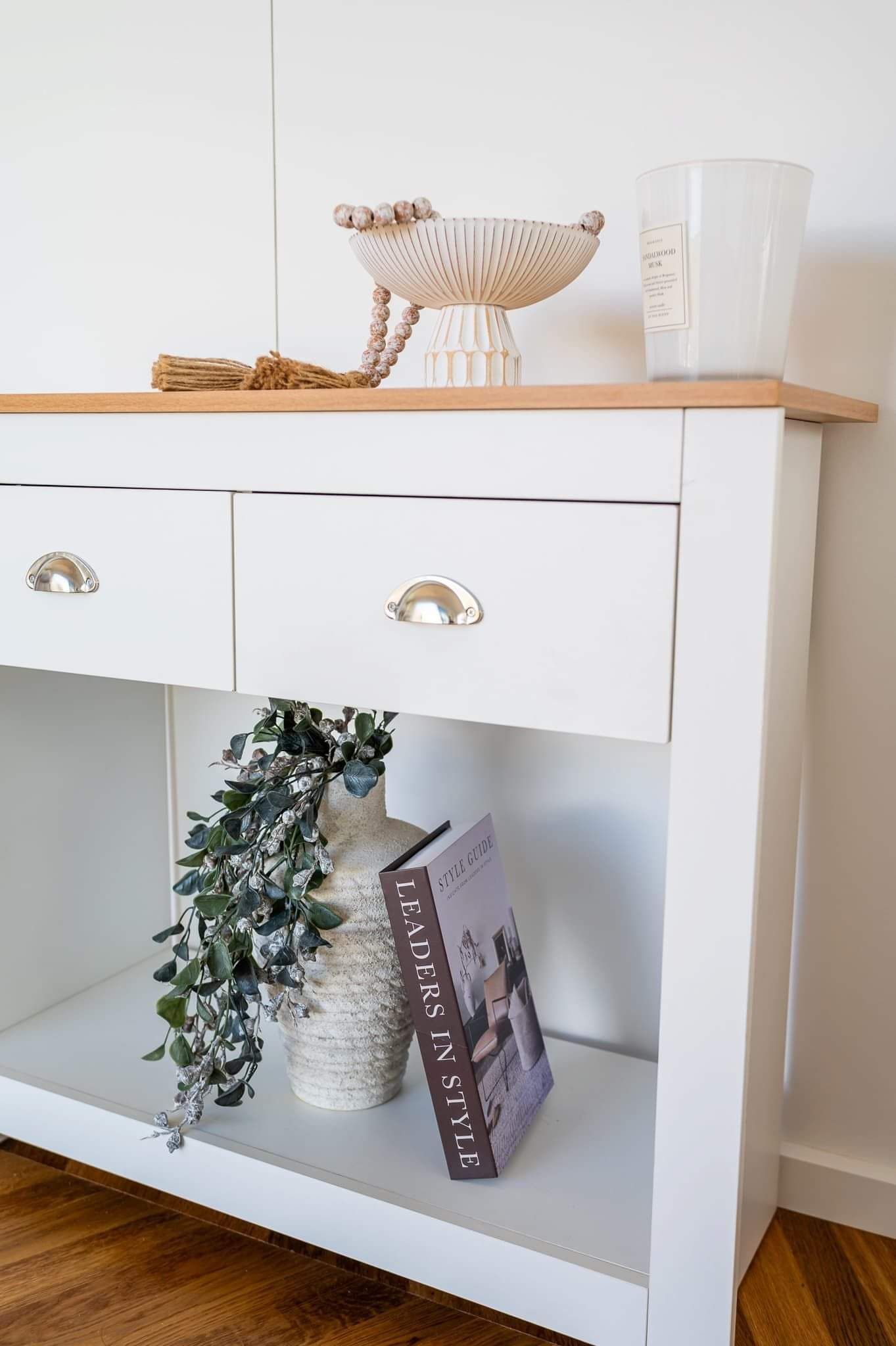tiny home cabin book shelf with book and plant pot 