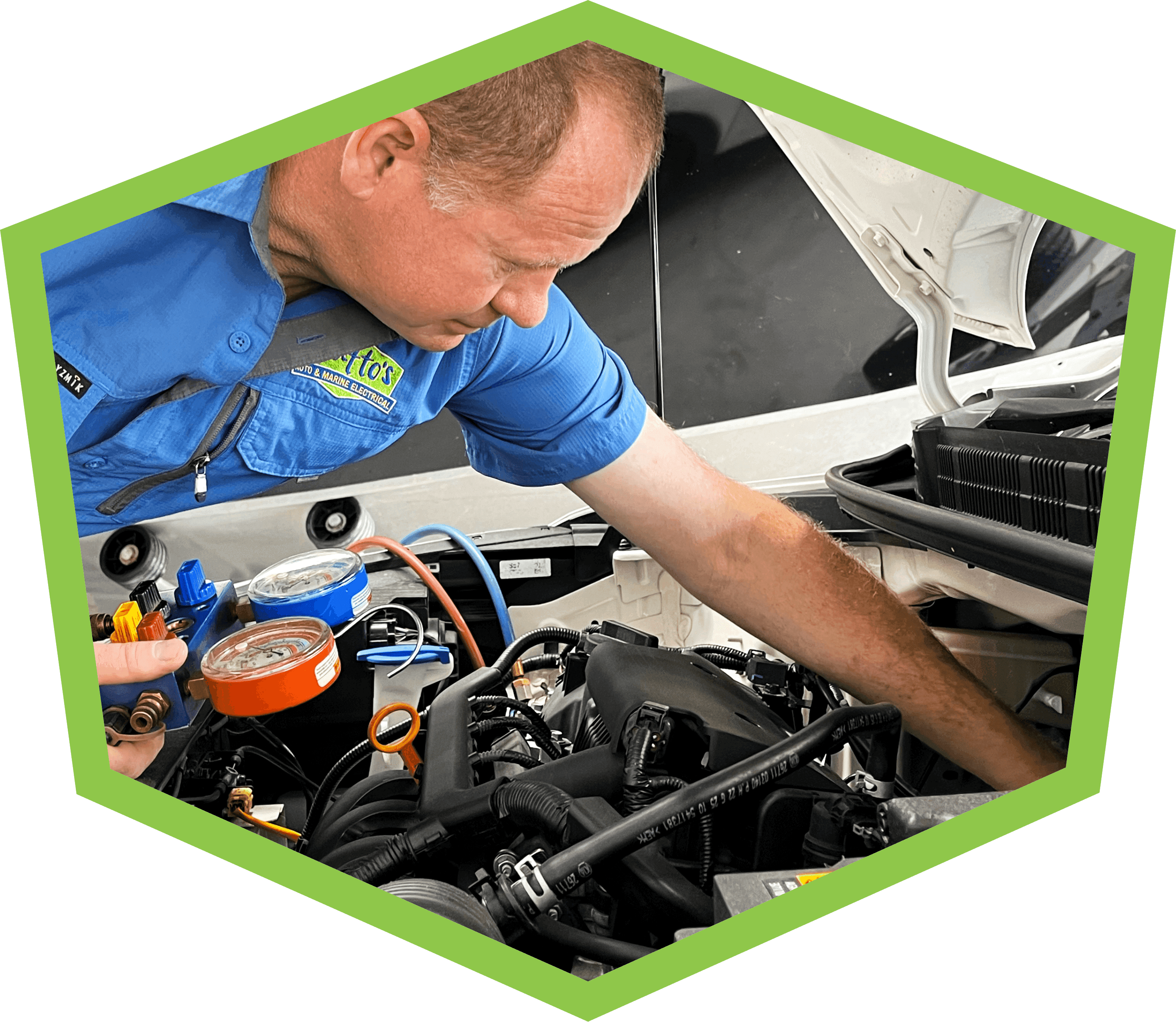 Photo of Paul servicing air conditioning in a car