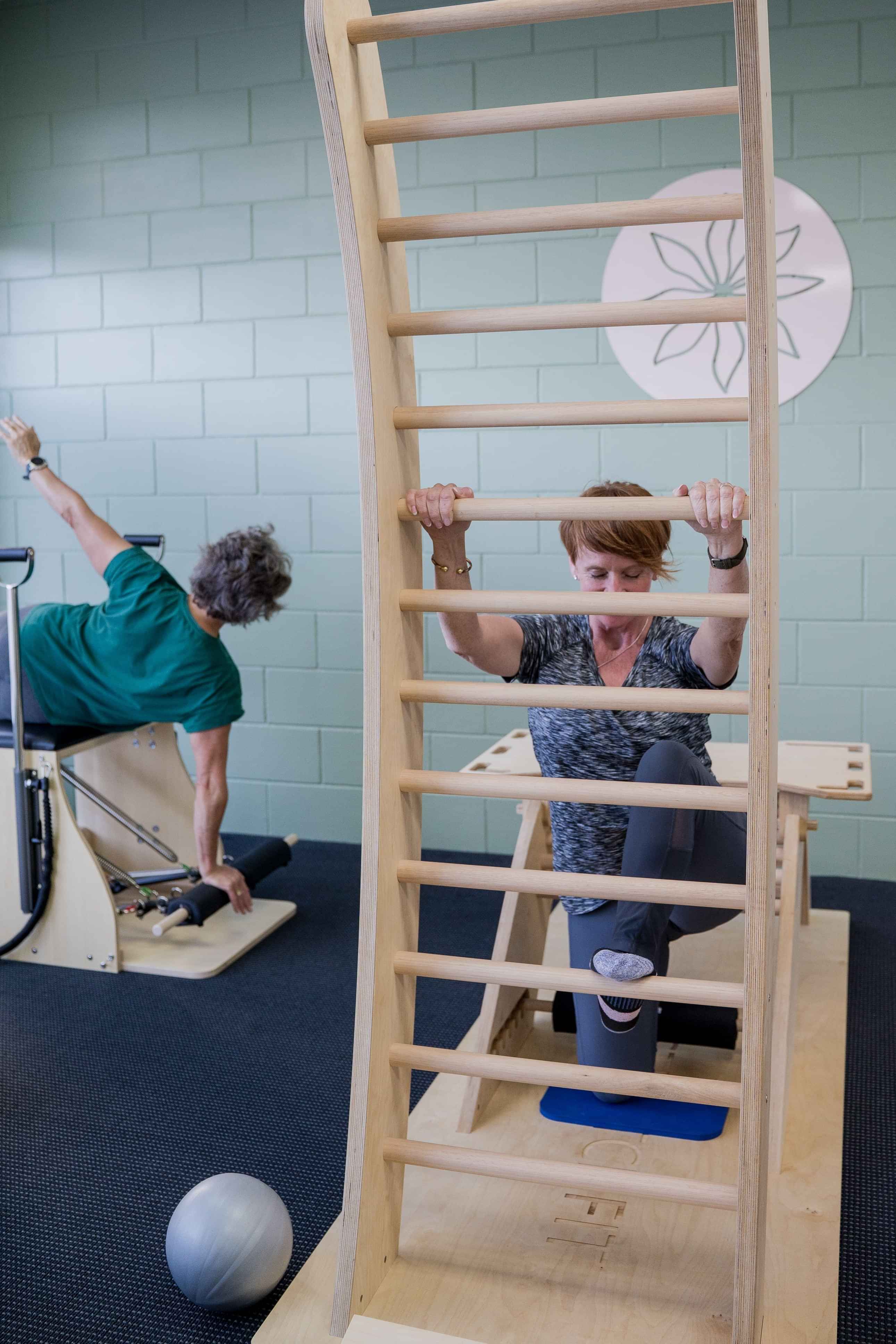 Image of woman on stretching machine at Self, wellness studio in Alexandra.