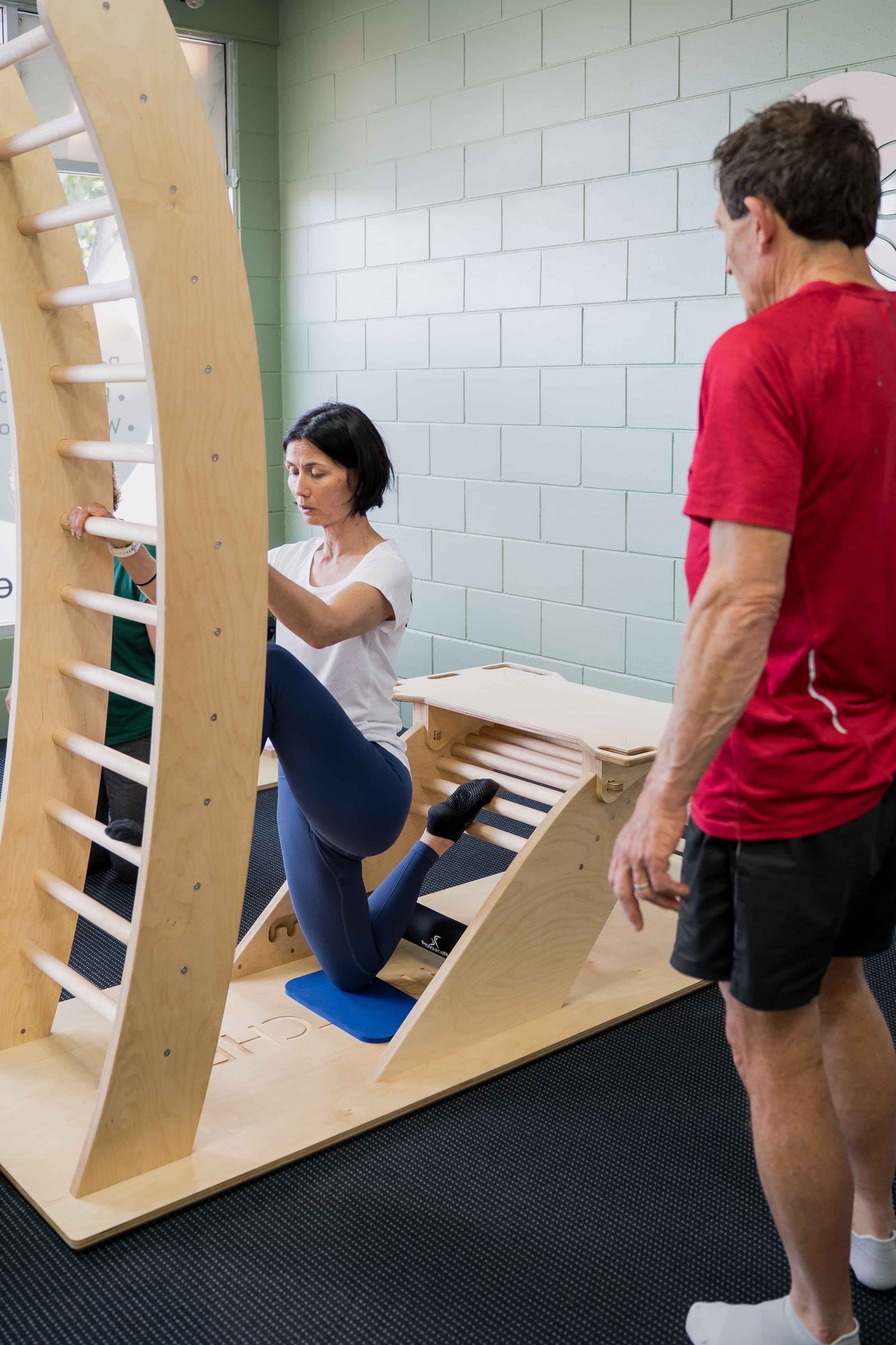 Image of woman on stretching machine at Self, wellness studio in Alexandra.