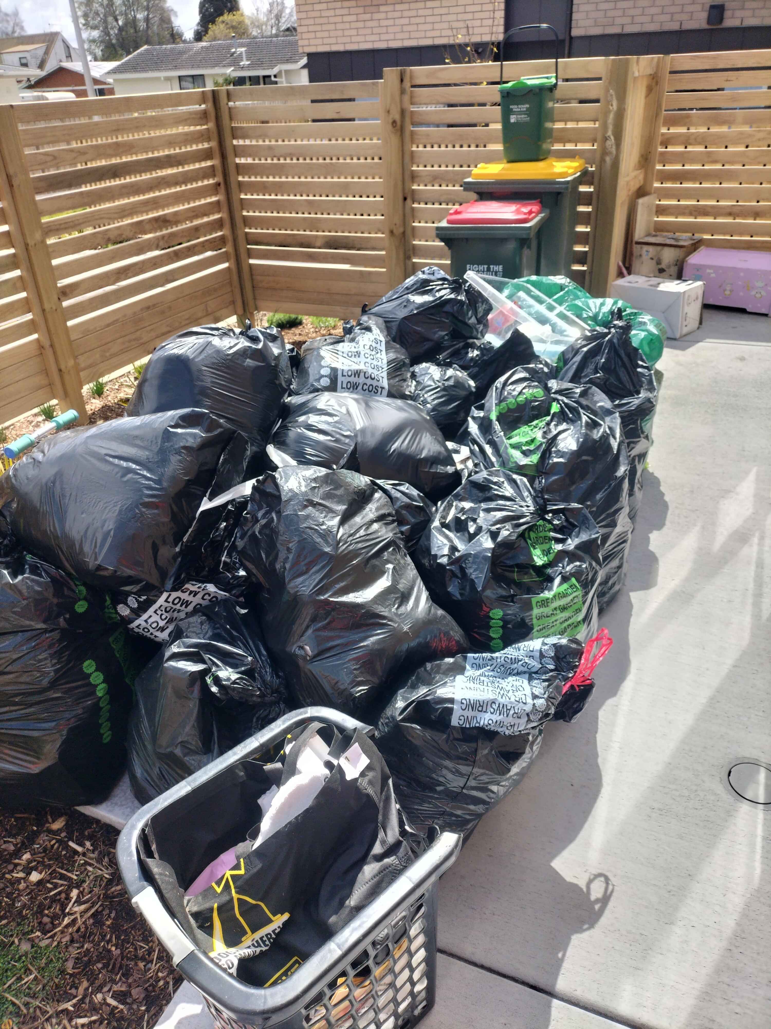 Junk furniture loaded on back of collection truck