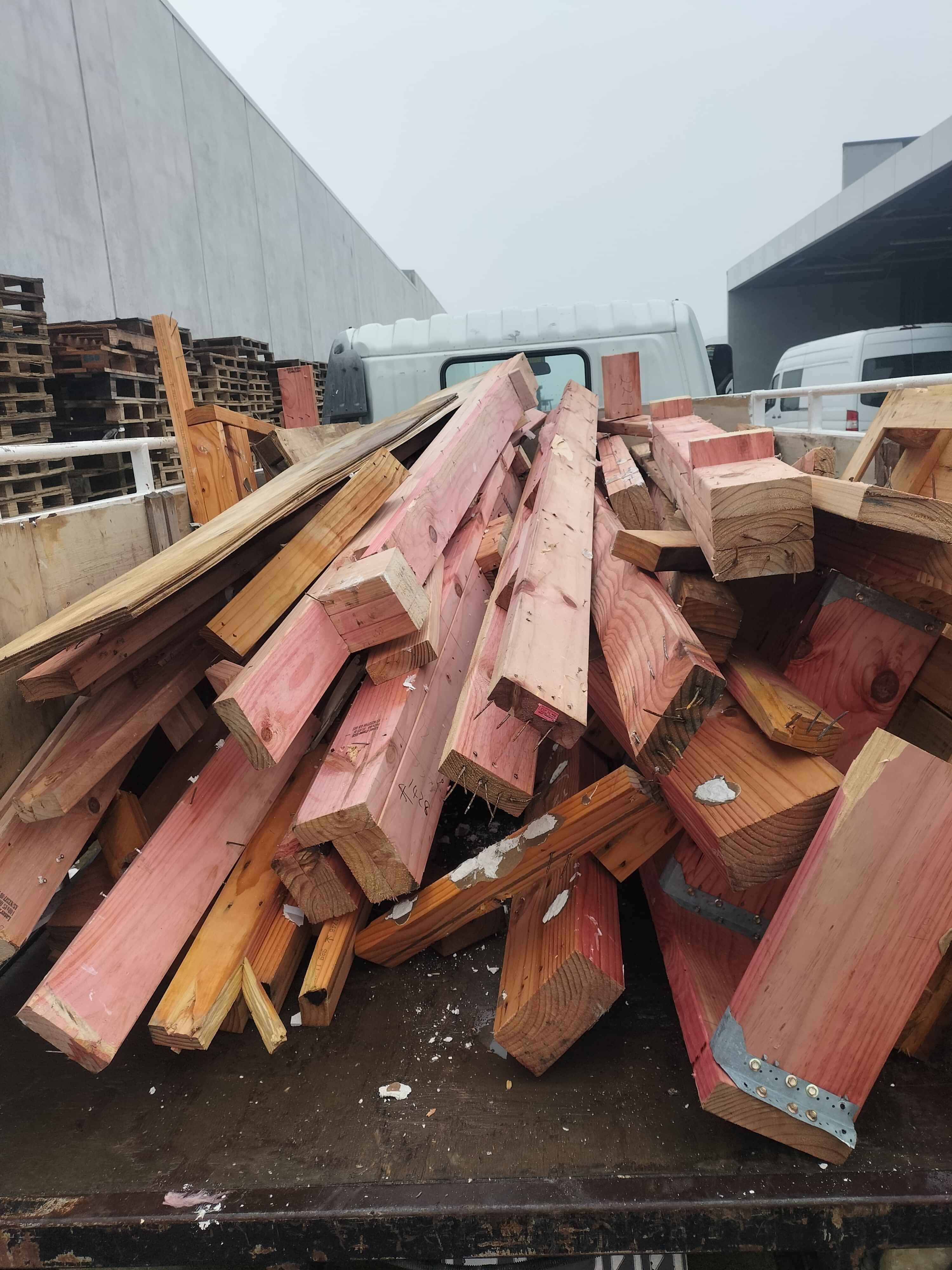 a pile of inorganic rubbish including old appliances and beer bottles
