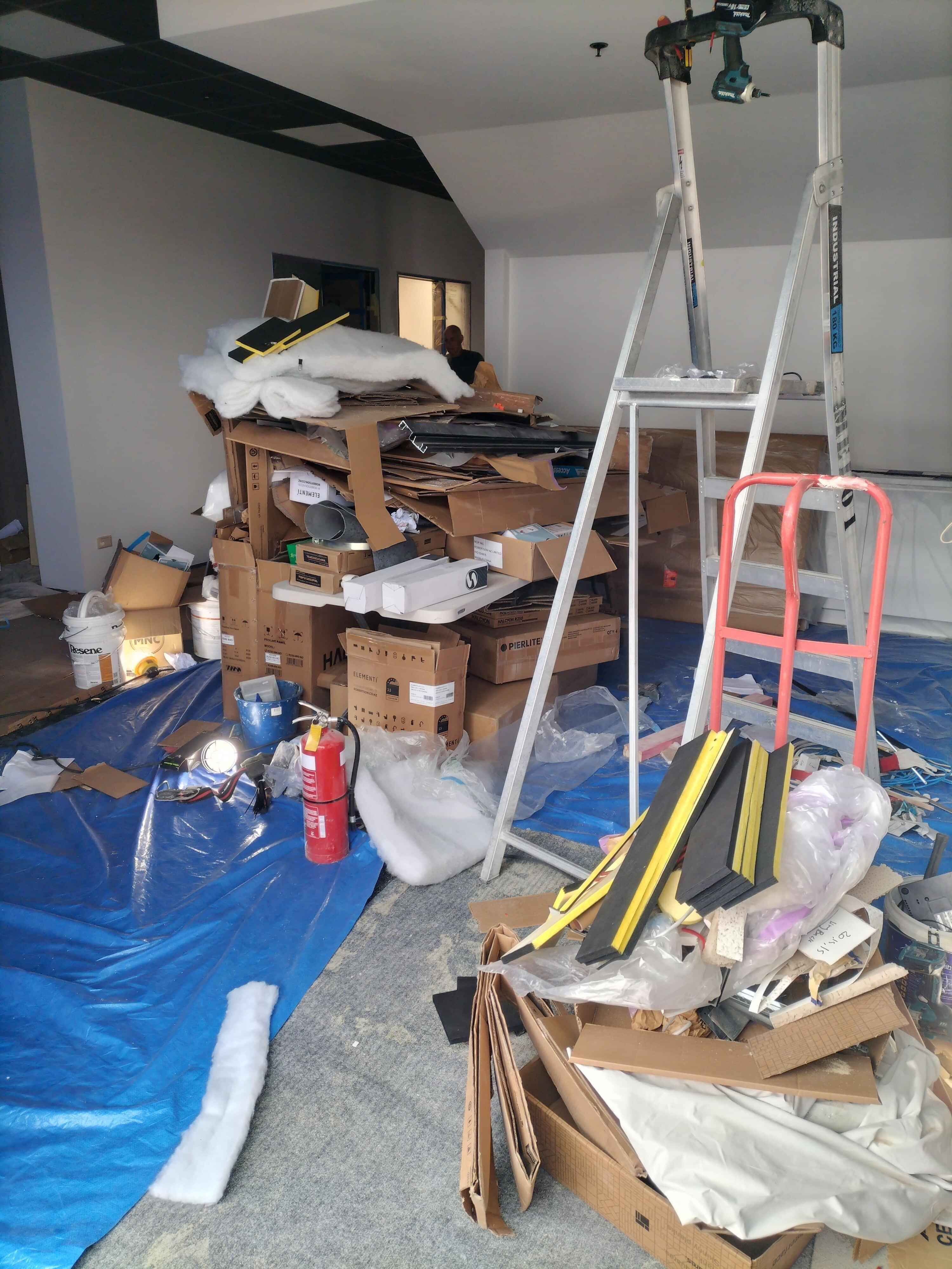 a pile of inorganic rubbish including old appliances and beer bottles