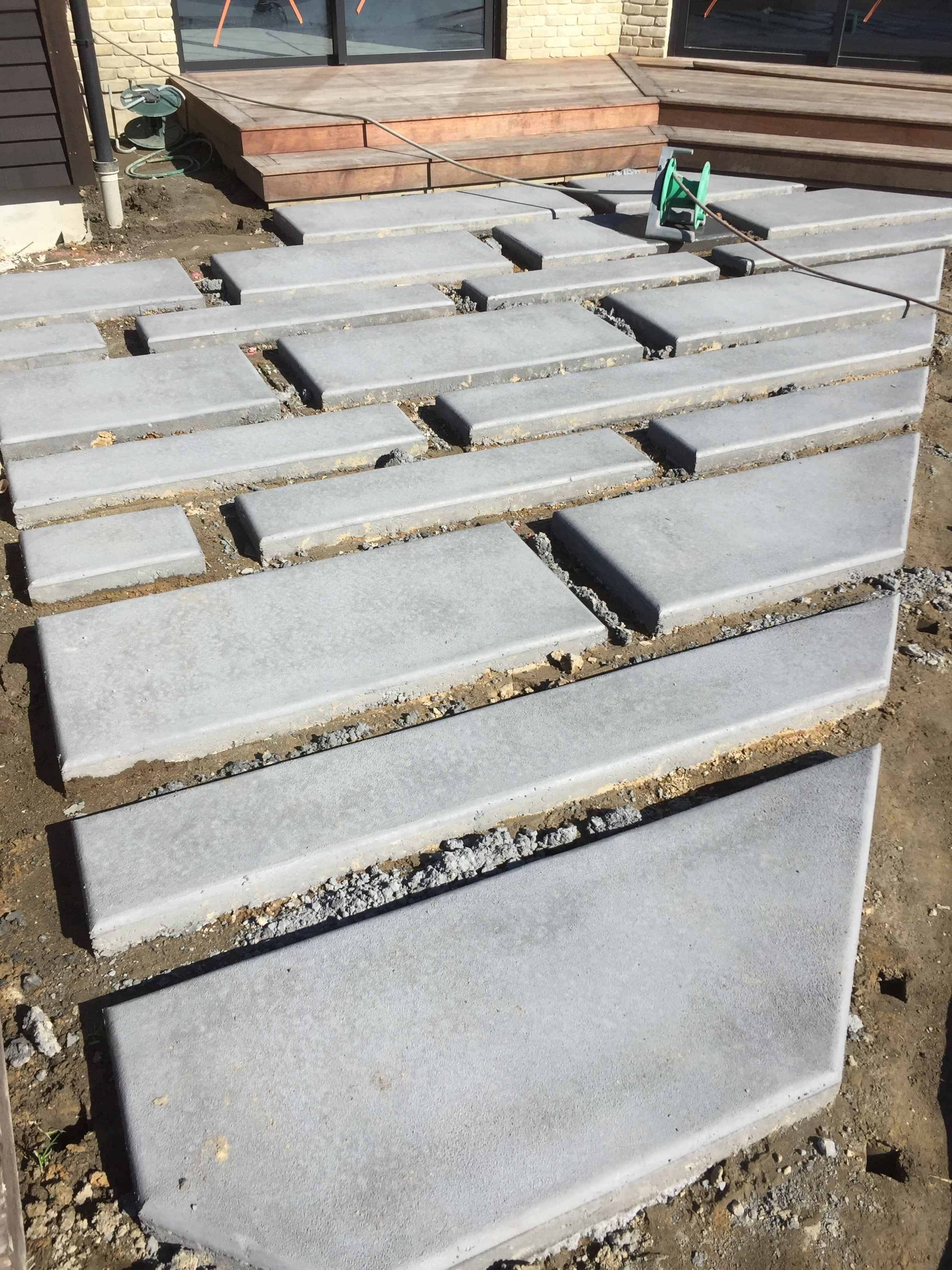 concrete pavers of various different sizes and shapes forming a path