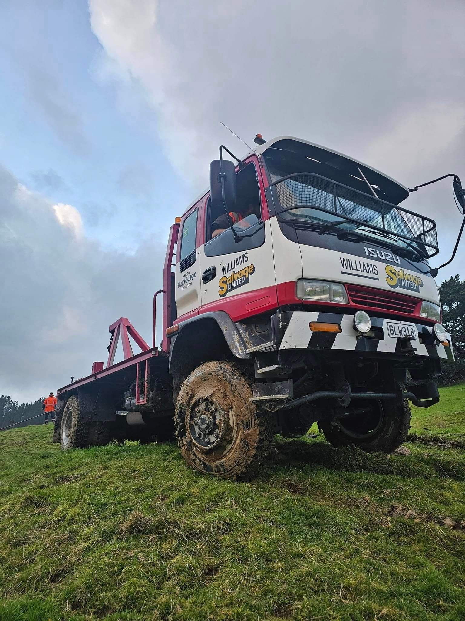 williams salvage tow truck on grass