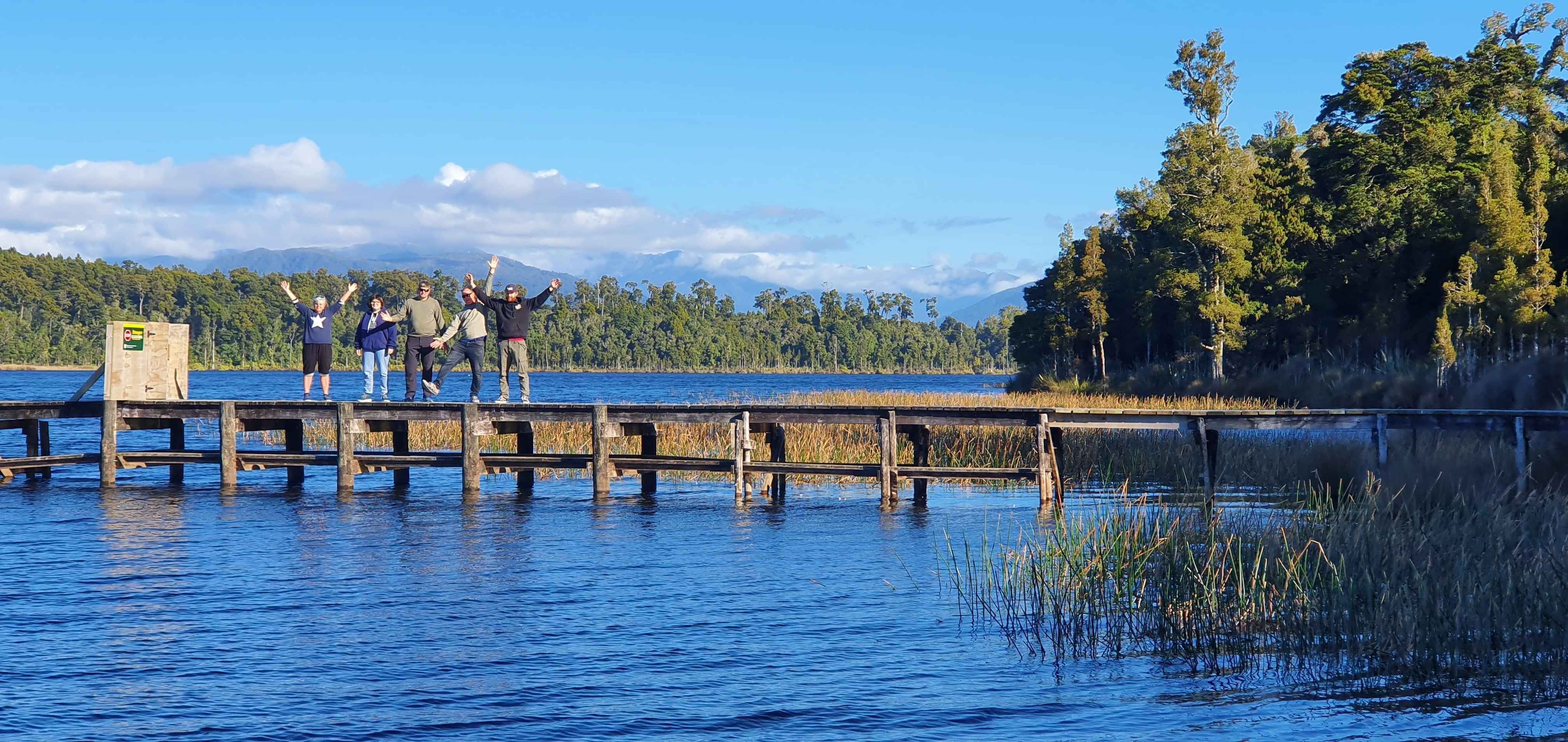 5 people in funny pose on jetty