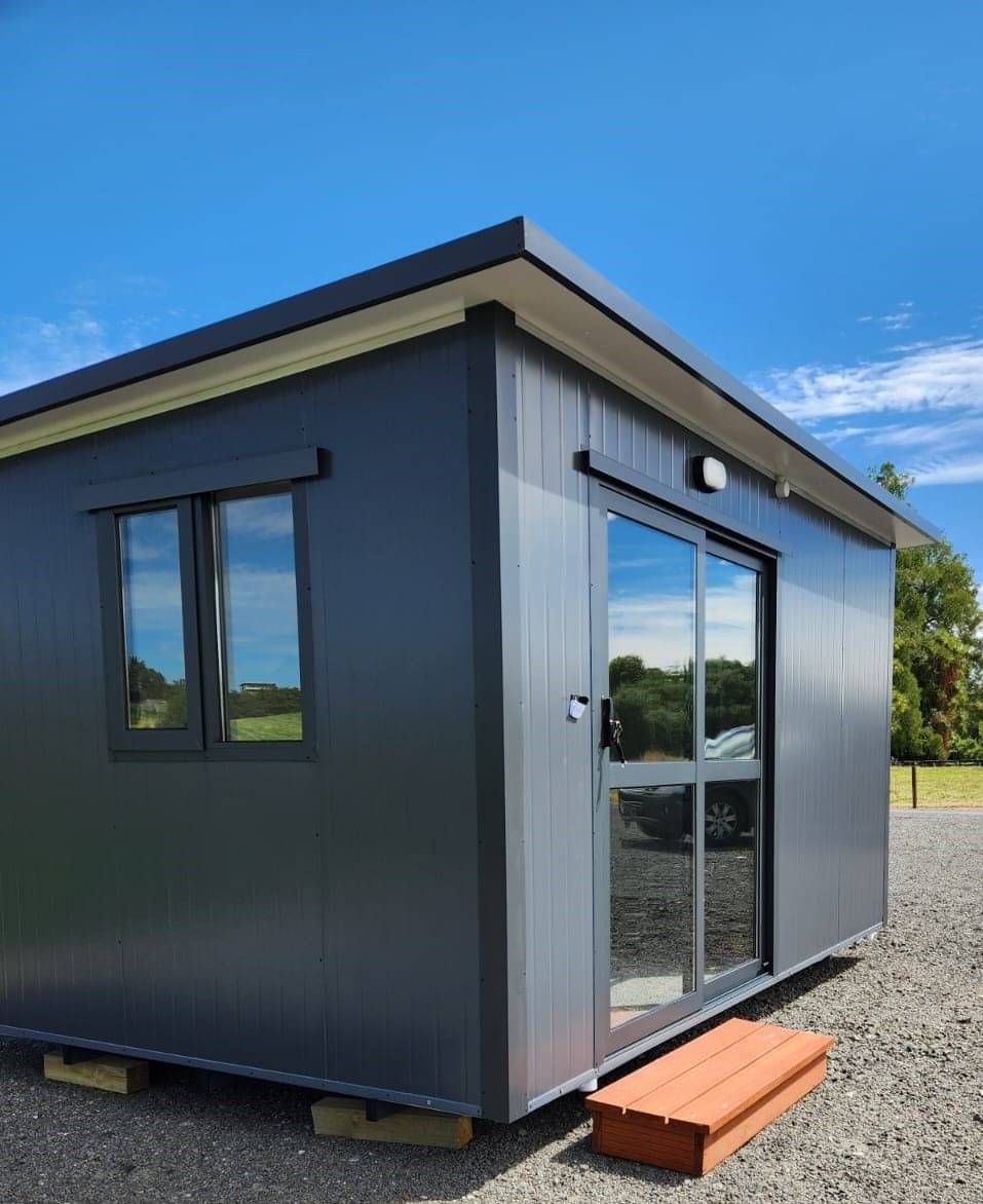 4.1m x 2.4m white cabin with window on the left short wall