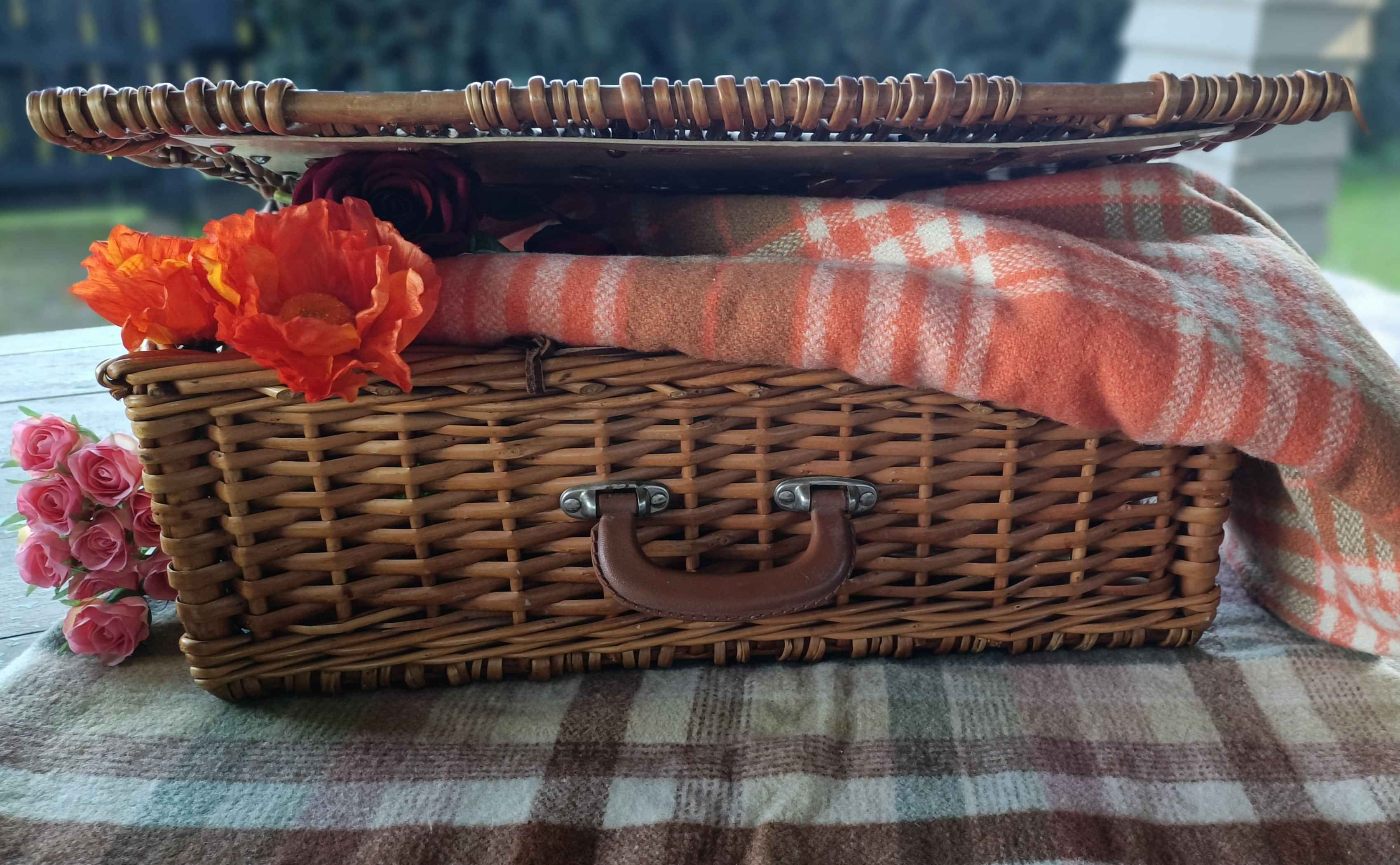 vintage picnic basket with blanket