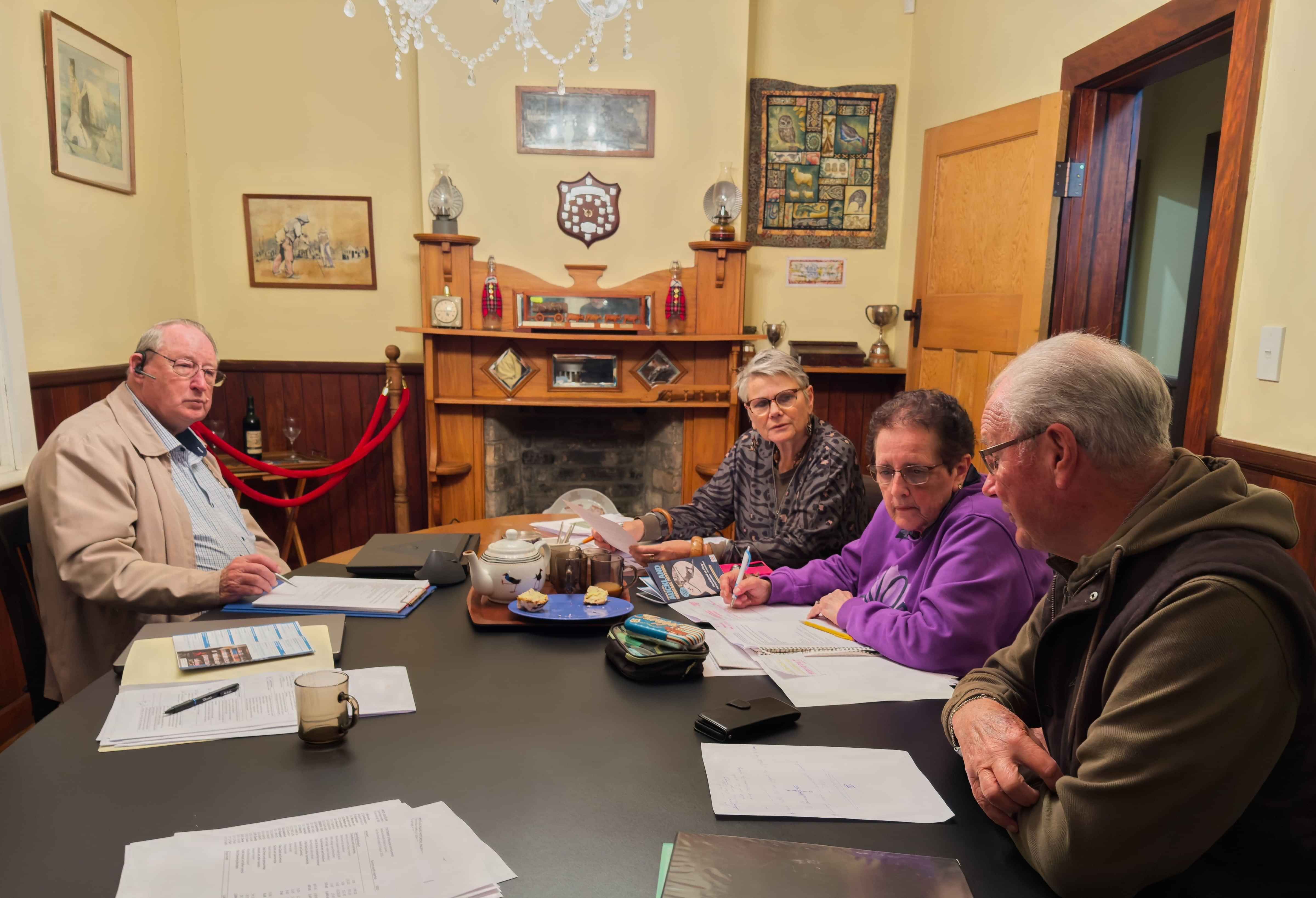 A group of people having a discussion at a table